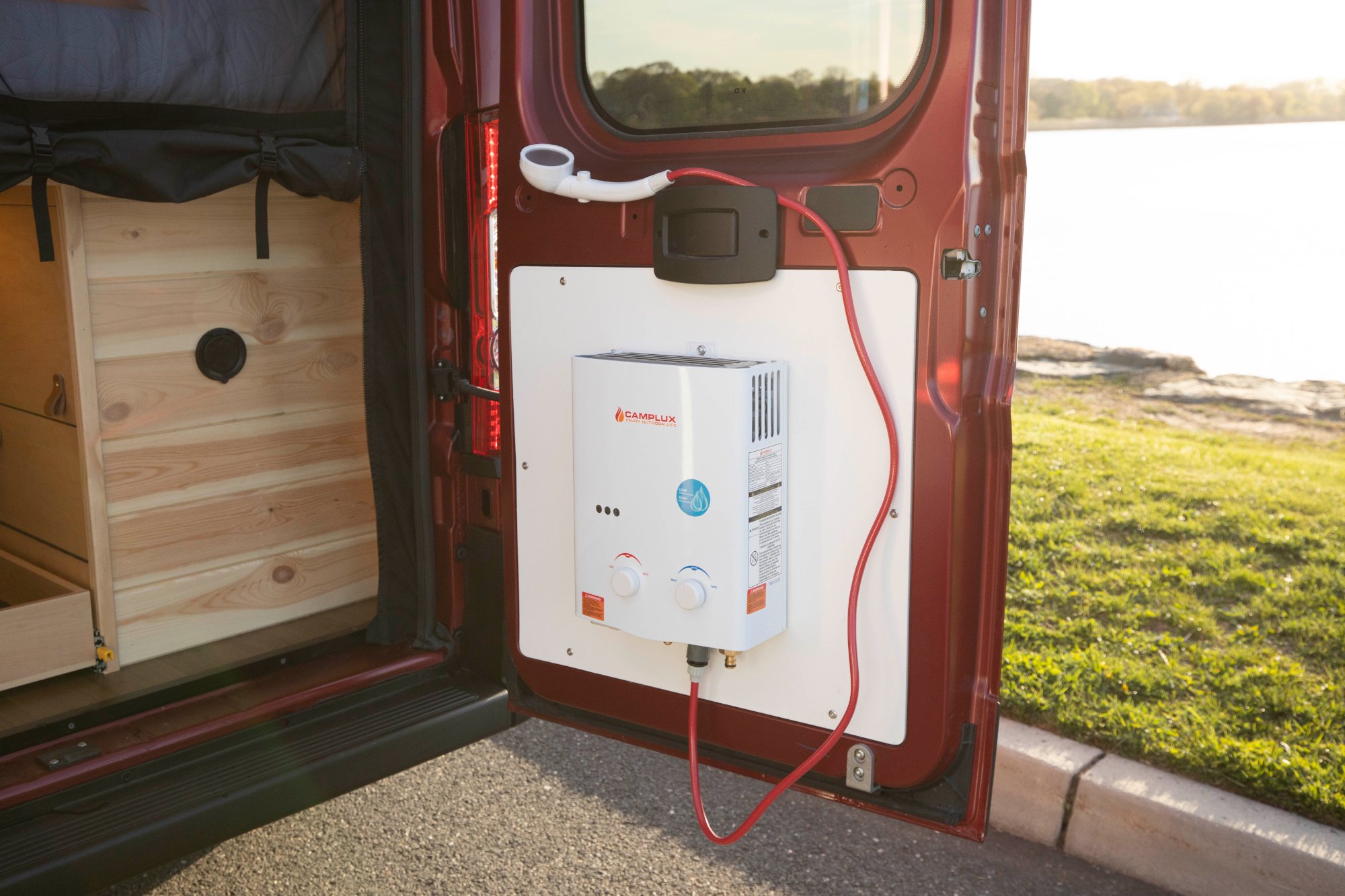 Camplux hot water heater mounted on rear door