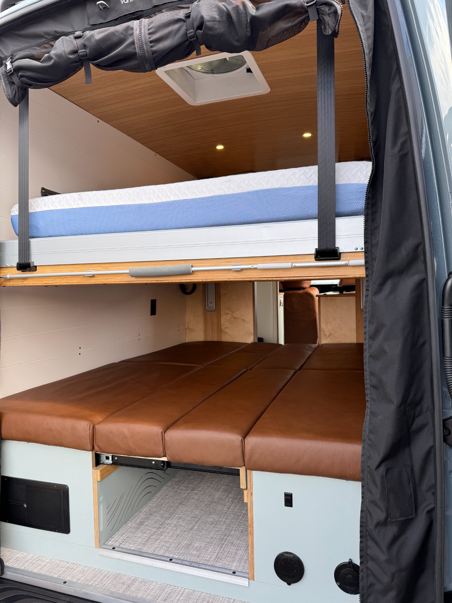 Loft — lift bed raised with lounge cushions converted below