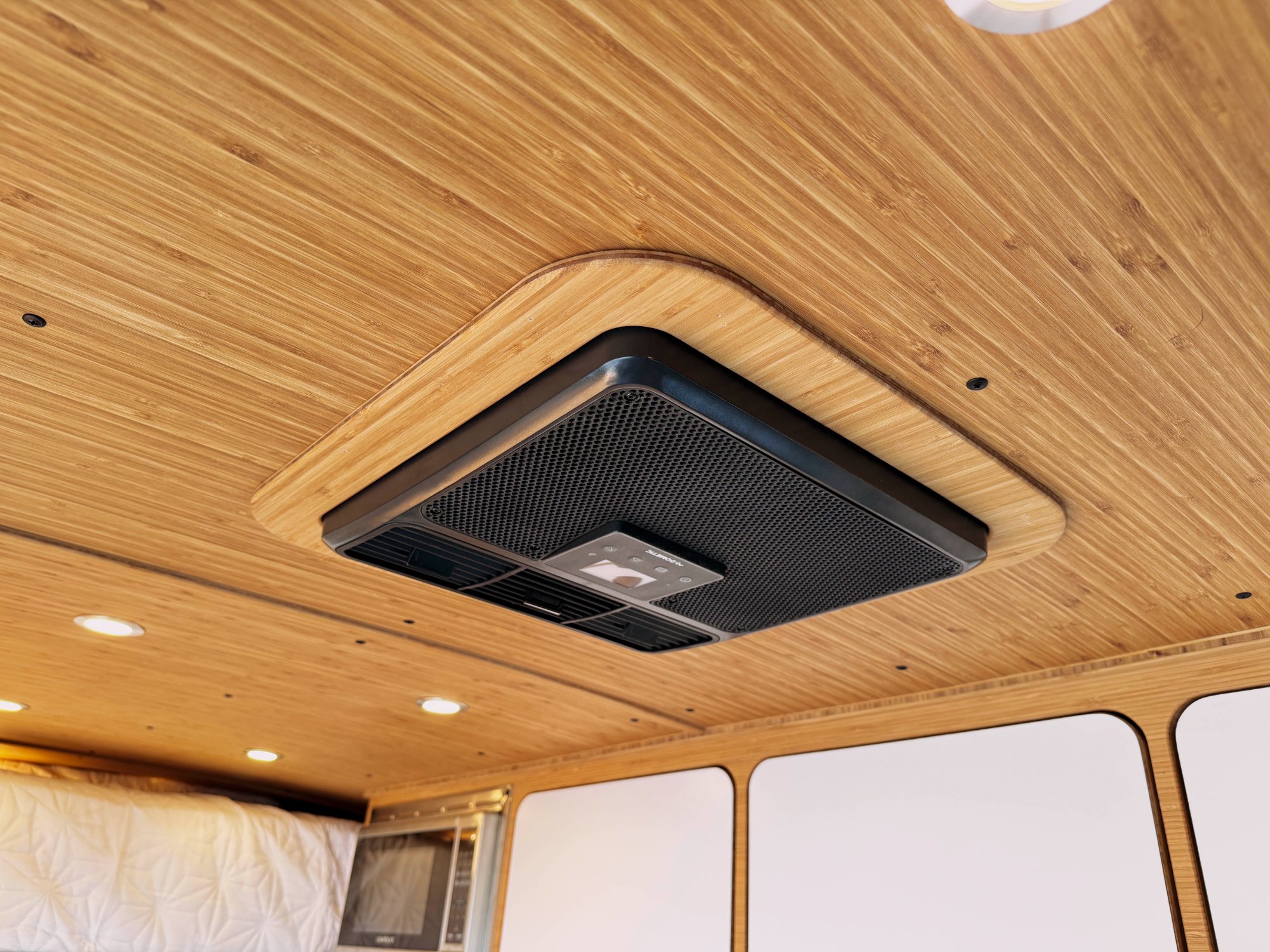 Loft — Dometic ceiling AC flush-mounted in bamboo ceiling