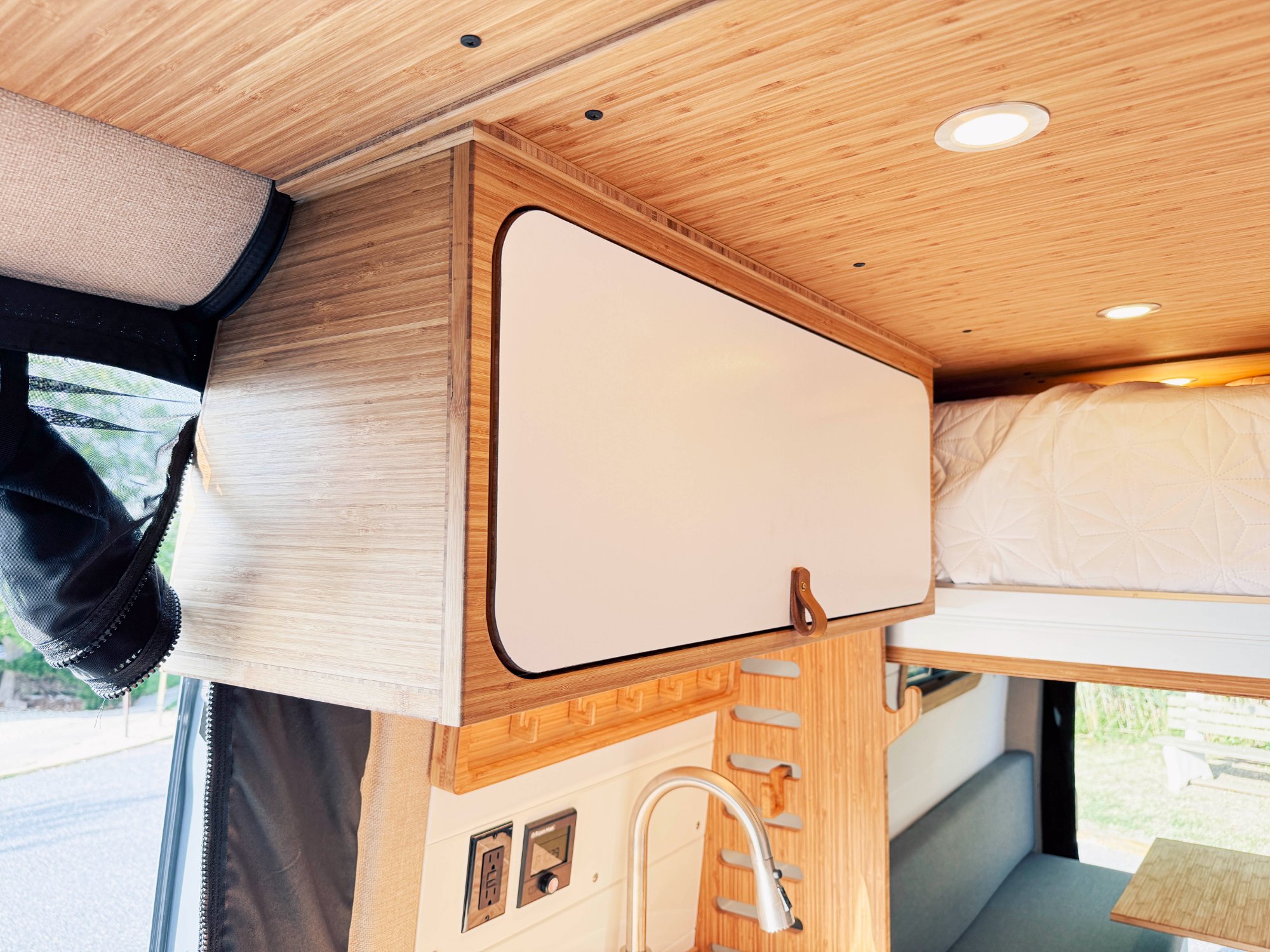 Loft — overhead cabinet and lift bed edge detail