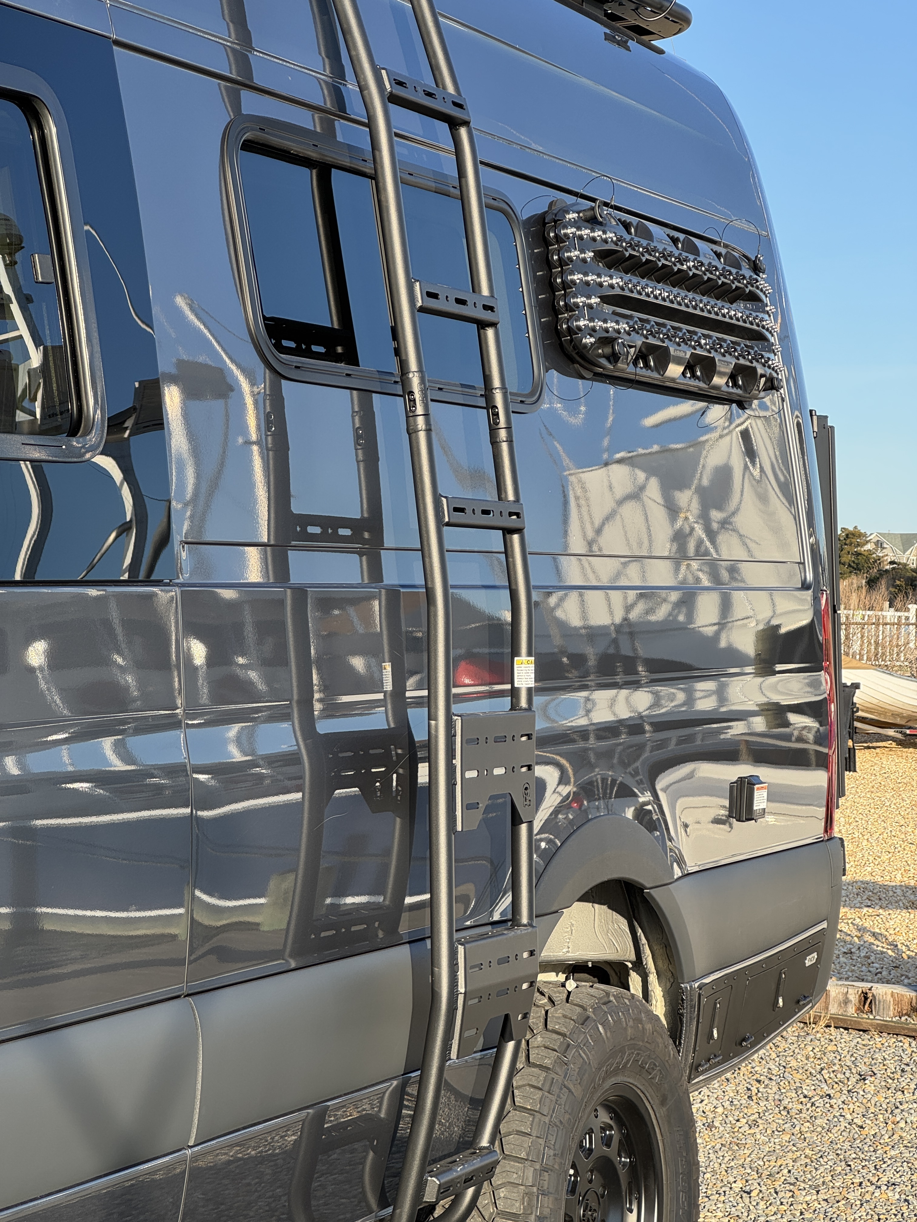 Baja Sprinter 170 4x4 — Aluminess rear ladder for rooftop access with side window and roof light bar visible above