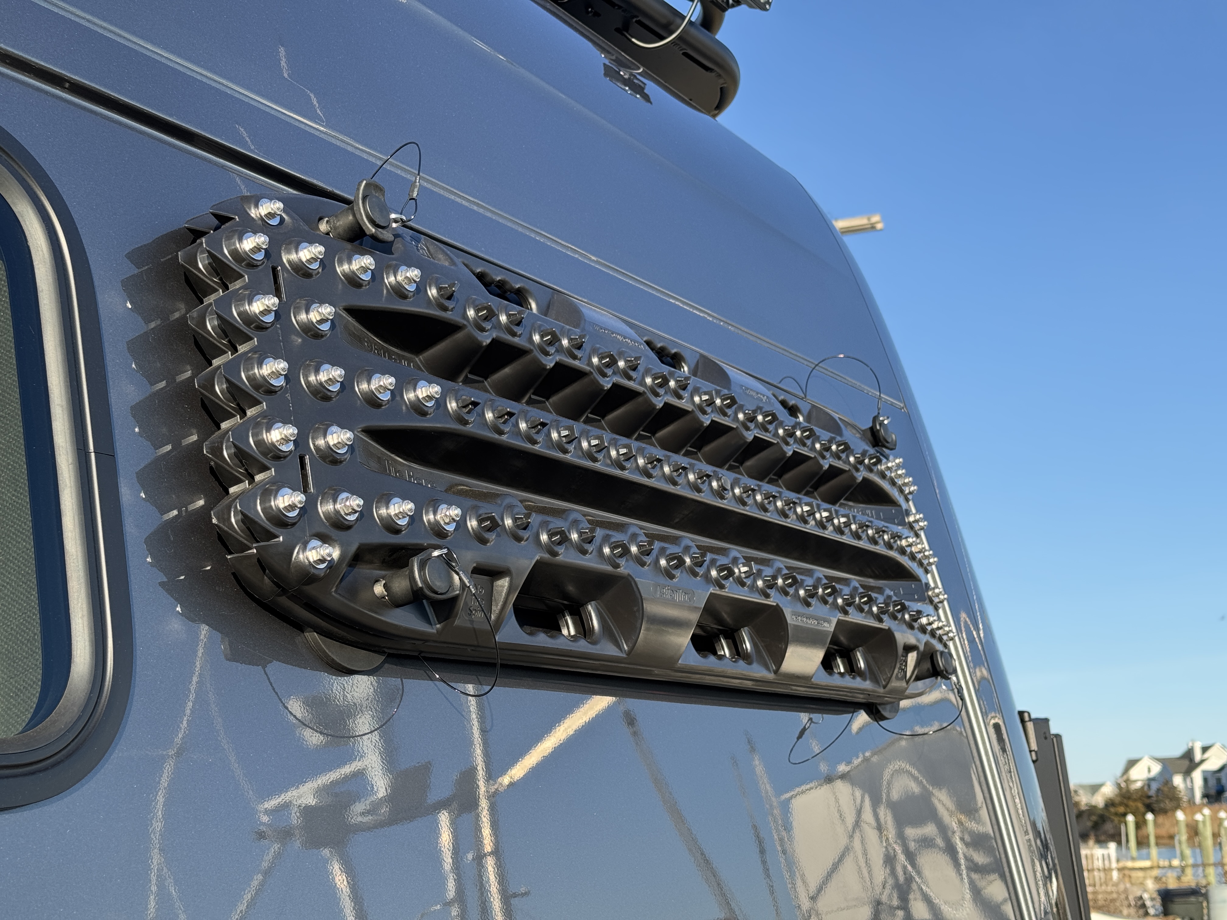 Baja Sprinter 170 4x4 — MaxTrax recovery boards mounted on rear quarter panel for off-road traction