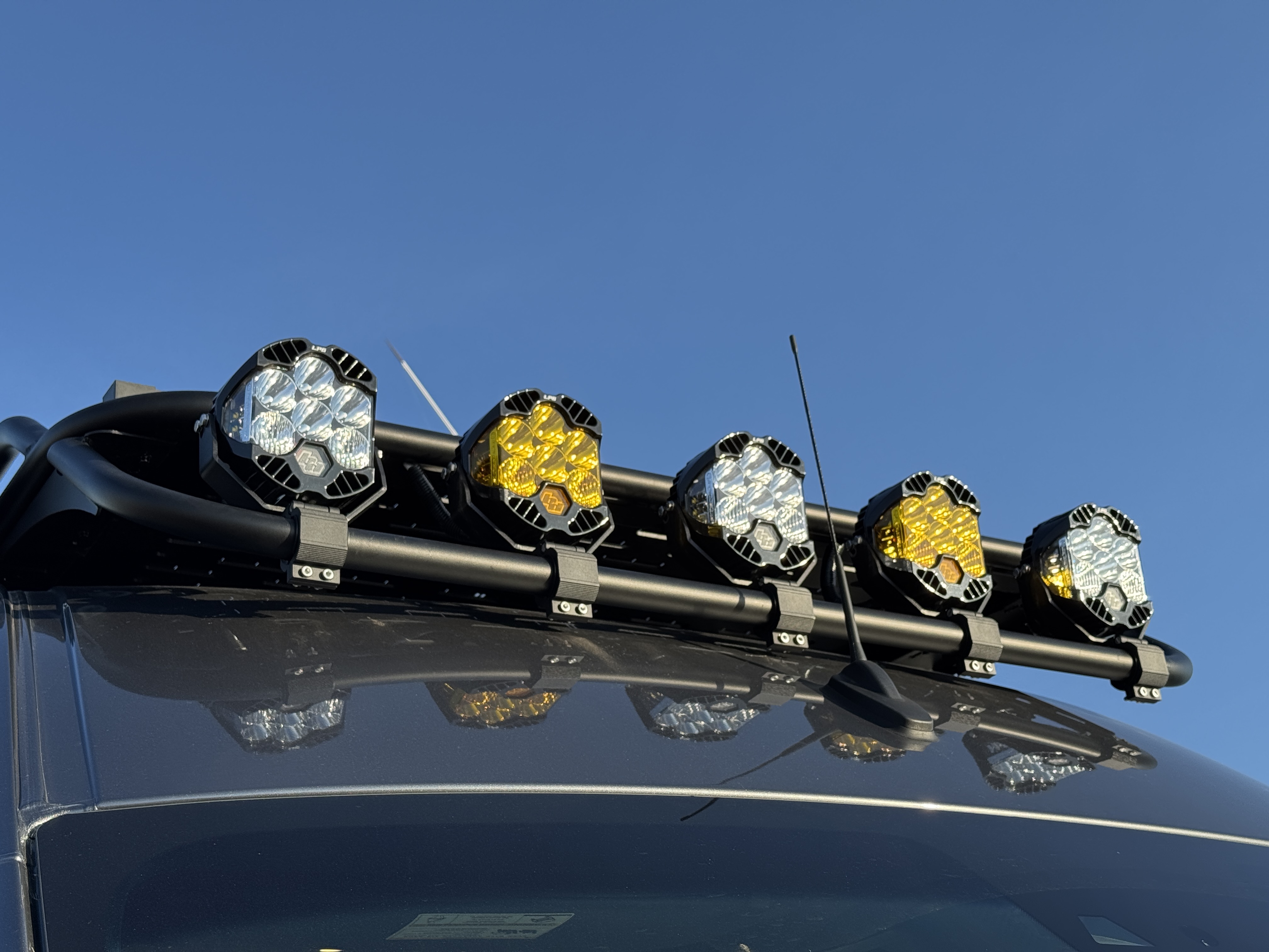 Baja Sprinter 170 4x4 — roof light bar from below showing mixed amber and white Baja Designs LP9 Pro auxiliary lights