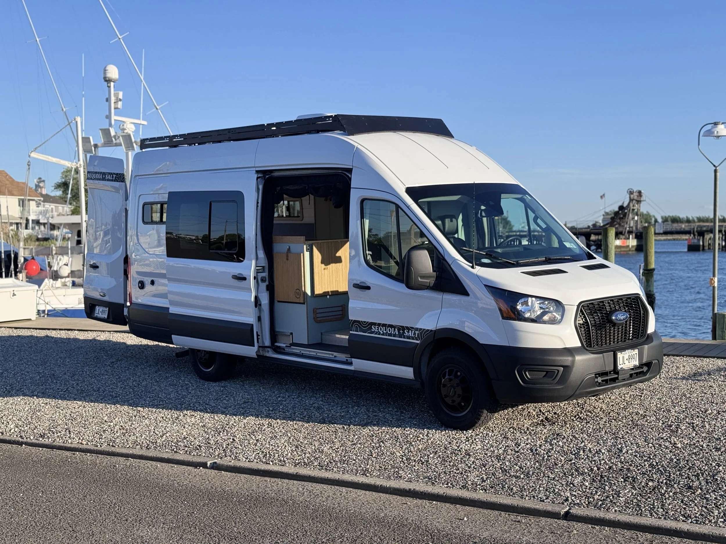 Ford Transit campervan exterior at marina