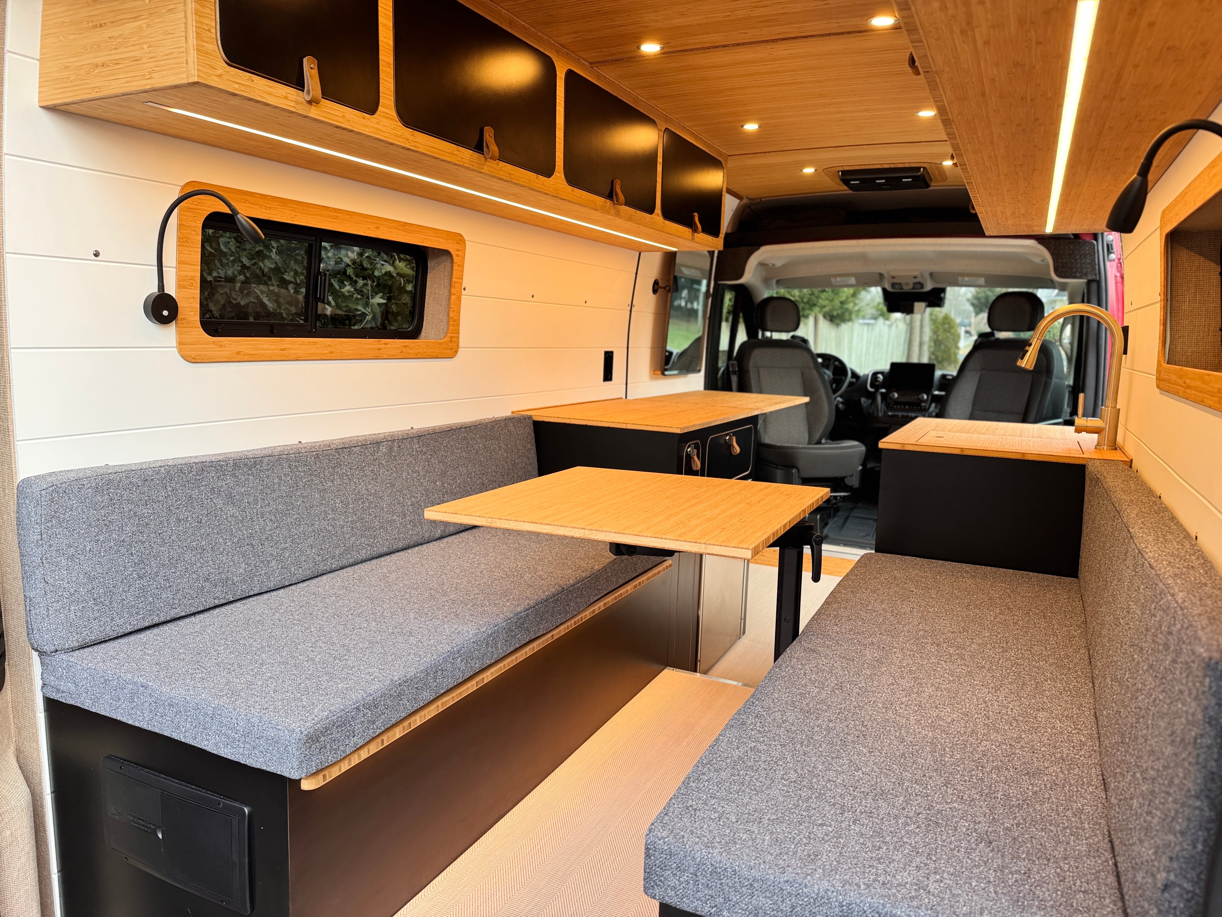 Artisan — Ram ProMaster 159, rear lounge interior with lift bed