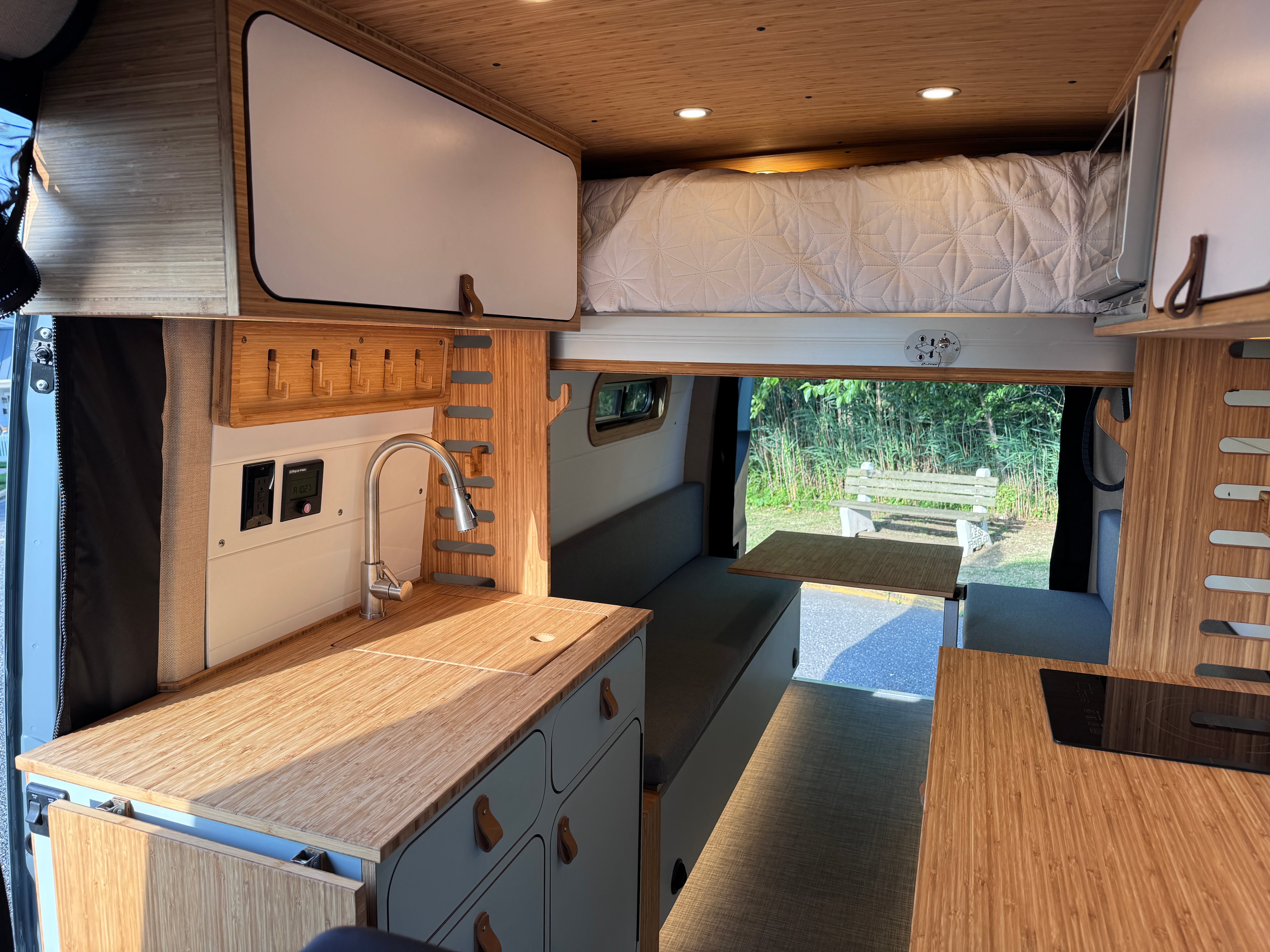 Empty Nester — Mercedes Sprinter 170, fixed bed over gear garage