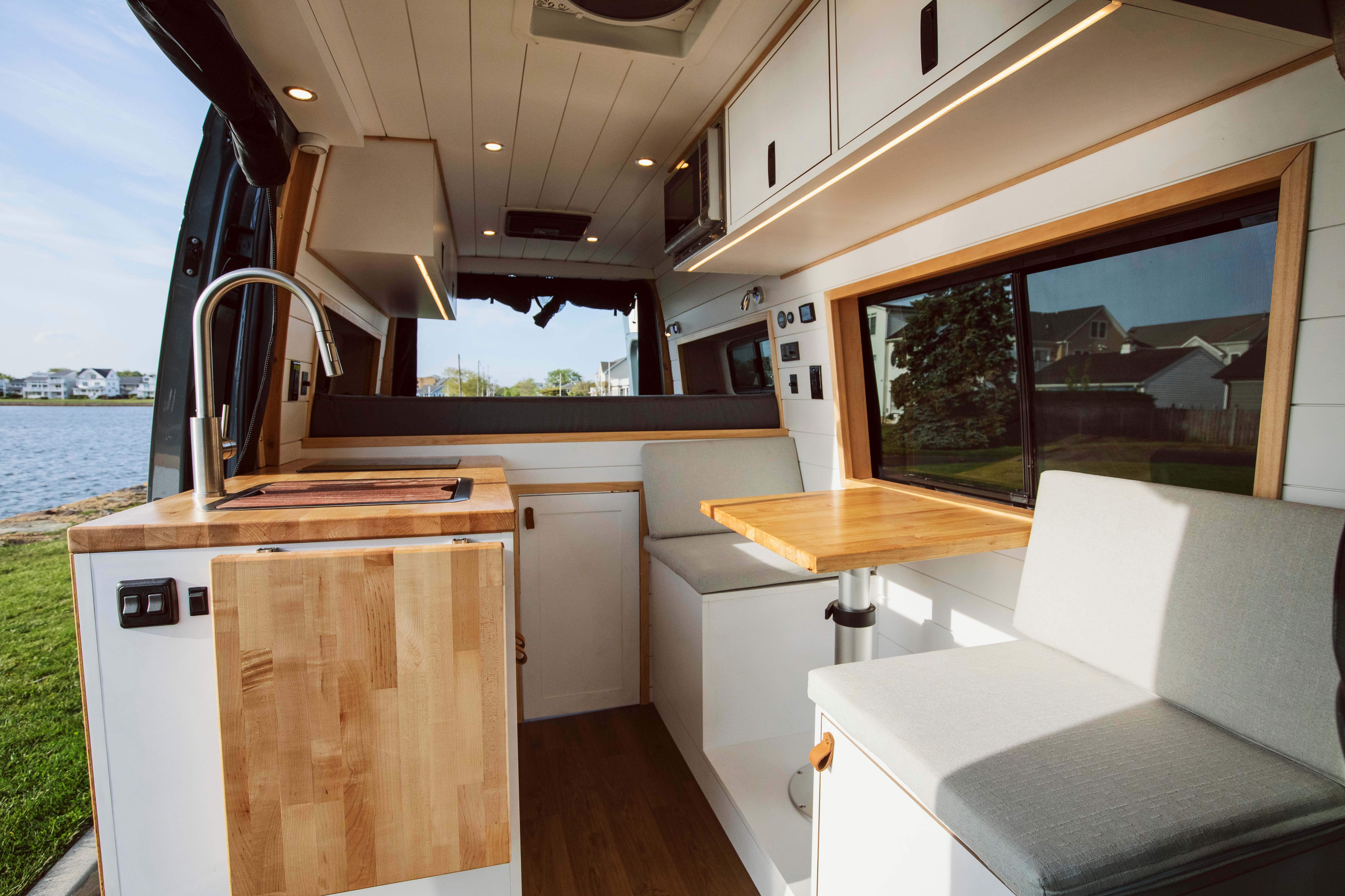 Heron — Mercedes Sprinter 144, rear lounge and galley interior