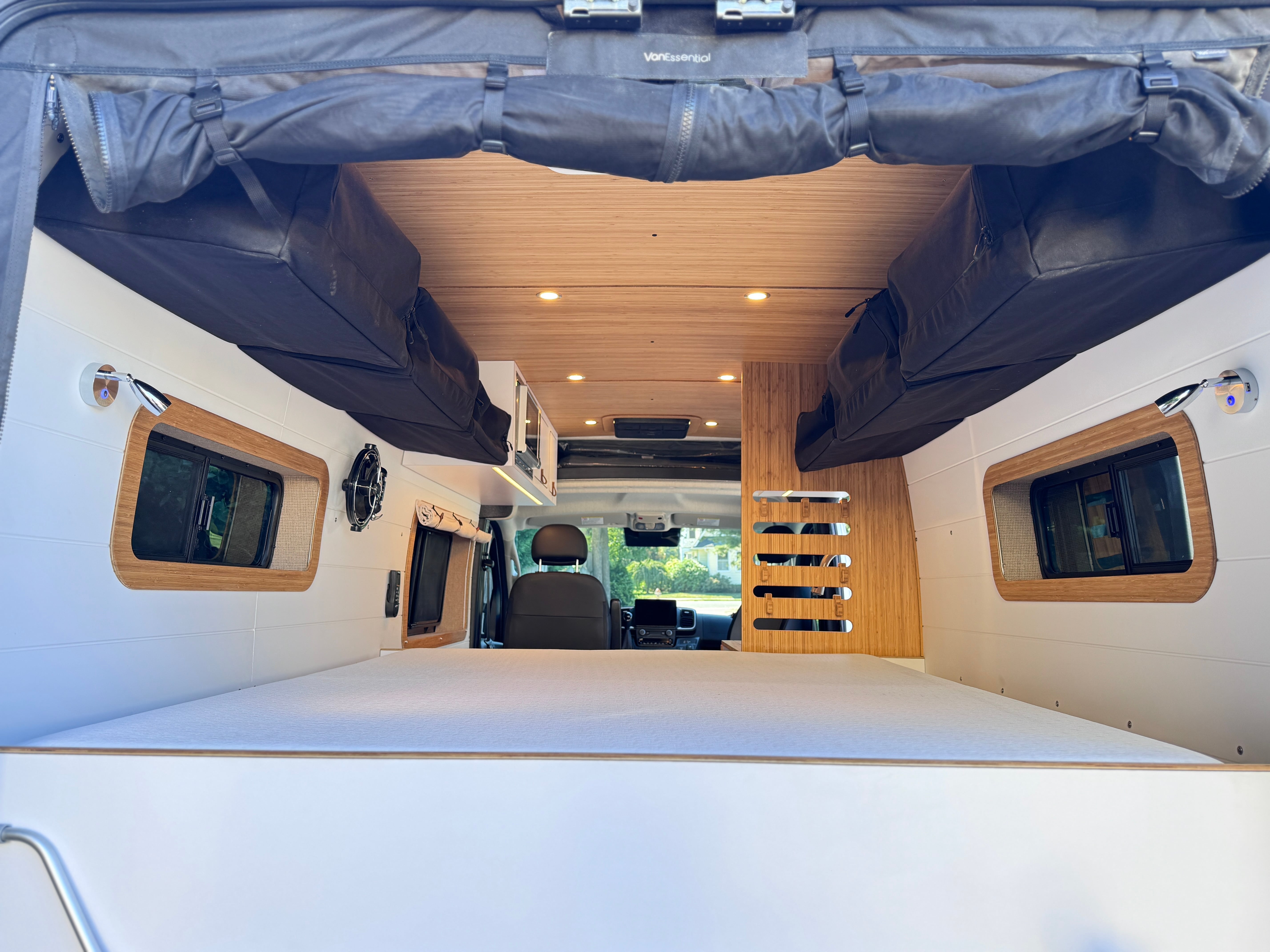 Highpoint NS — Ram ProMaster 159, rear bed and lounge interior