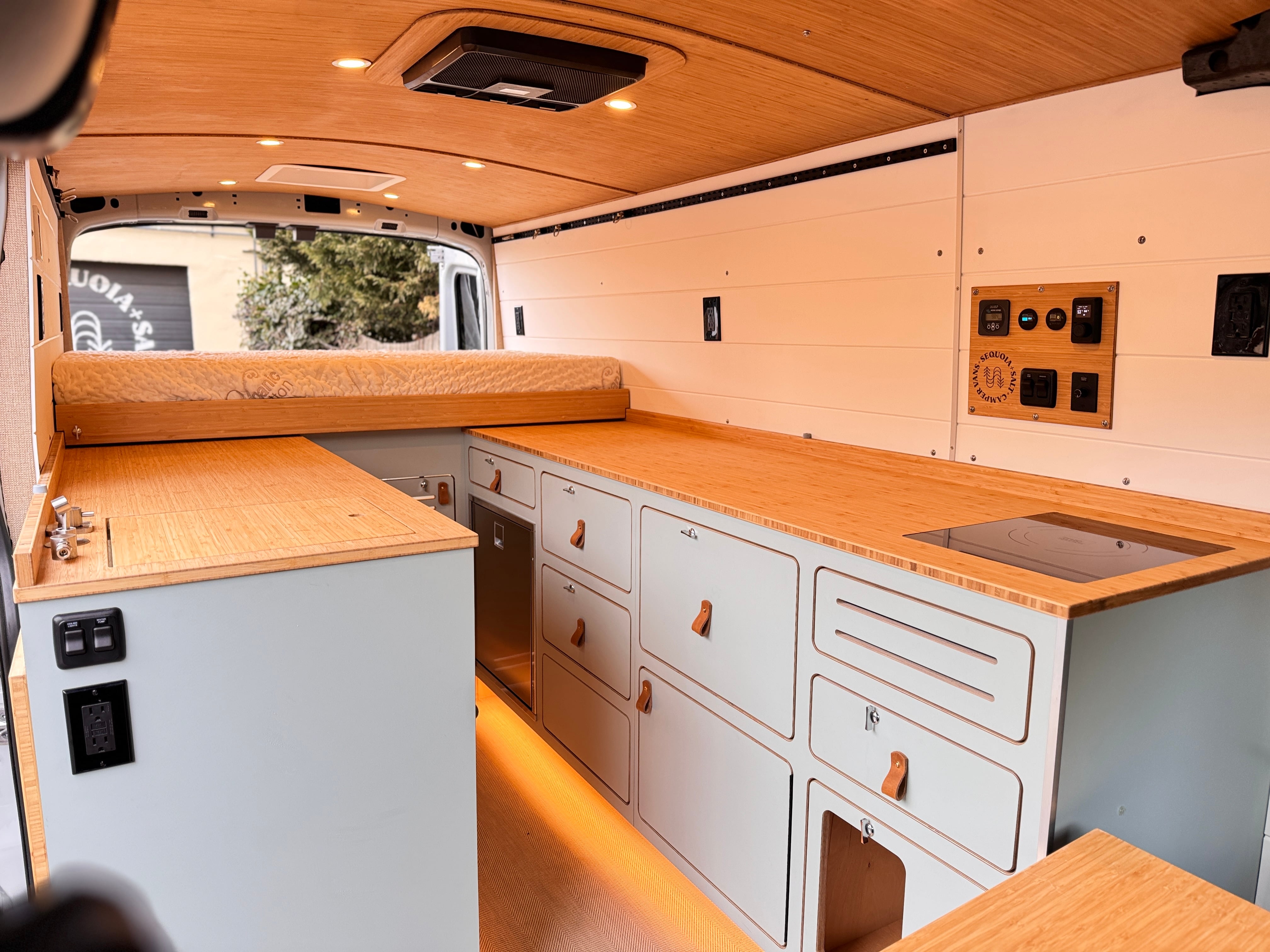 Nook — Ford Transit 148 mid-roof, galley and gear-garage interior