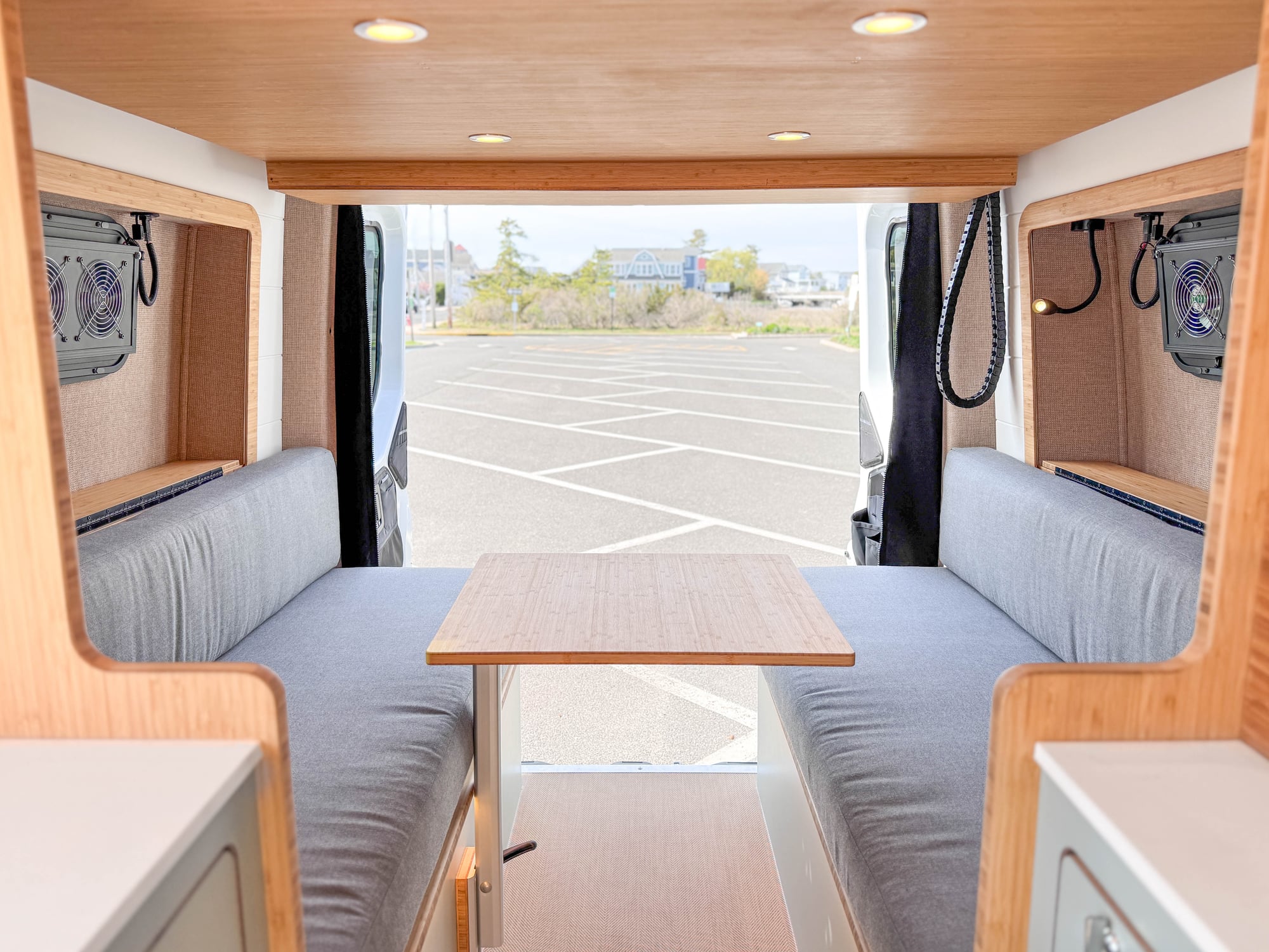 The Scout — east-west lift bed over the convertible lounge, Sprinter 144