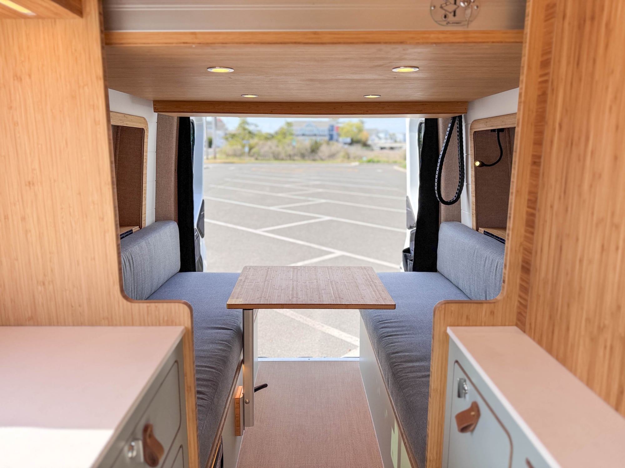 The Scout — convertible rear lounge with grey bench seating and bamboo interior