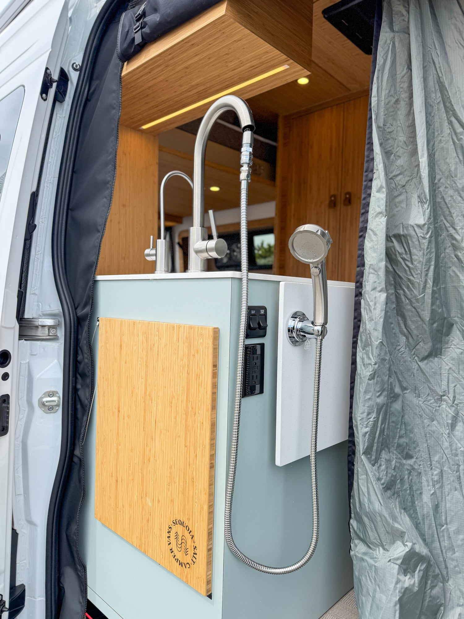 The Scout — exterior shower on bamboo, at the rear door