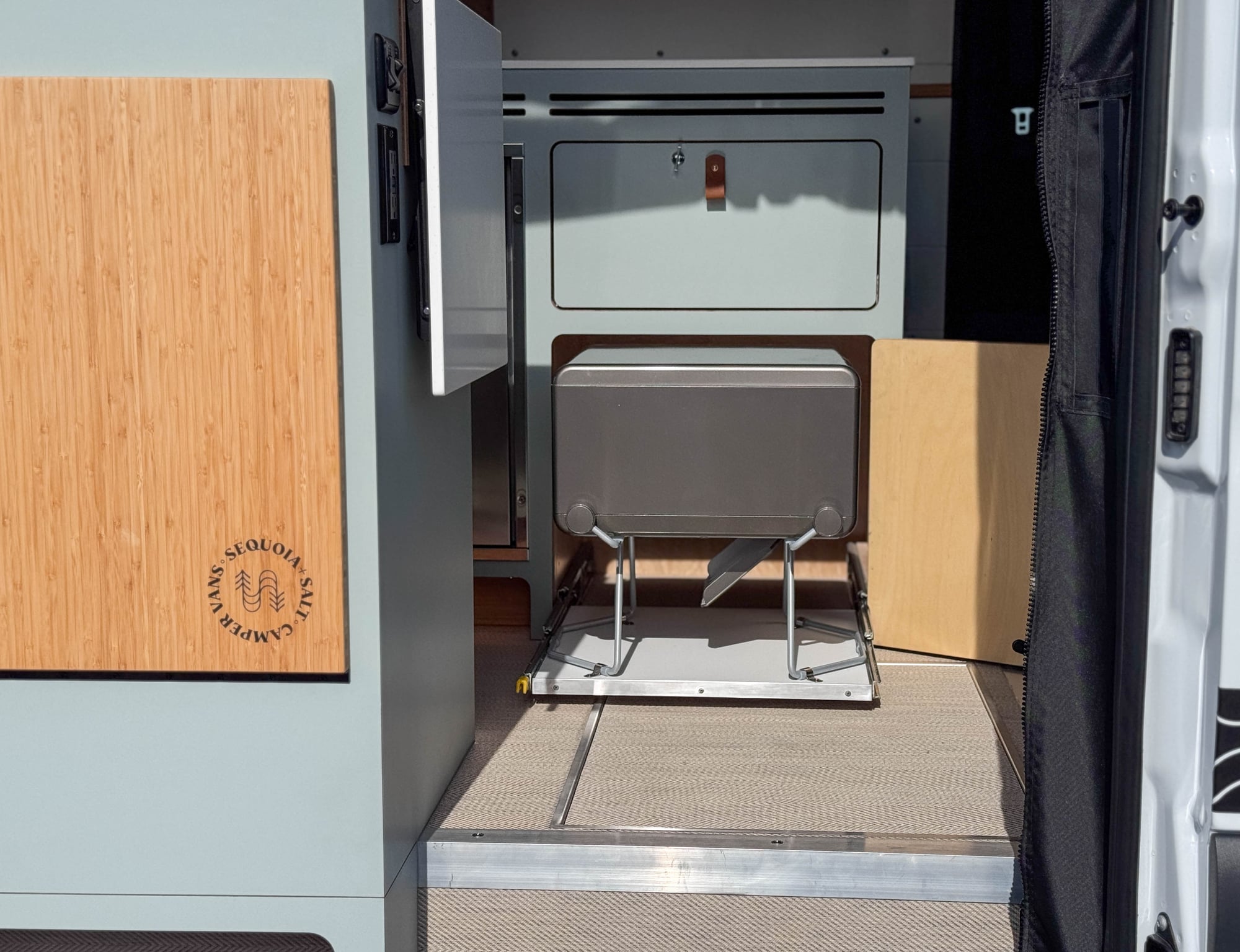The Scout — slide-out cabinet toilet deployed