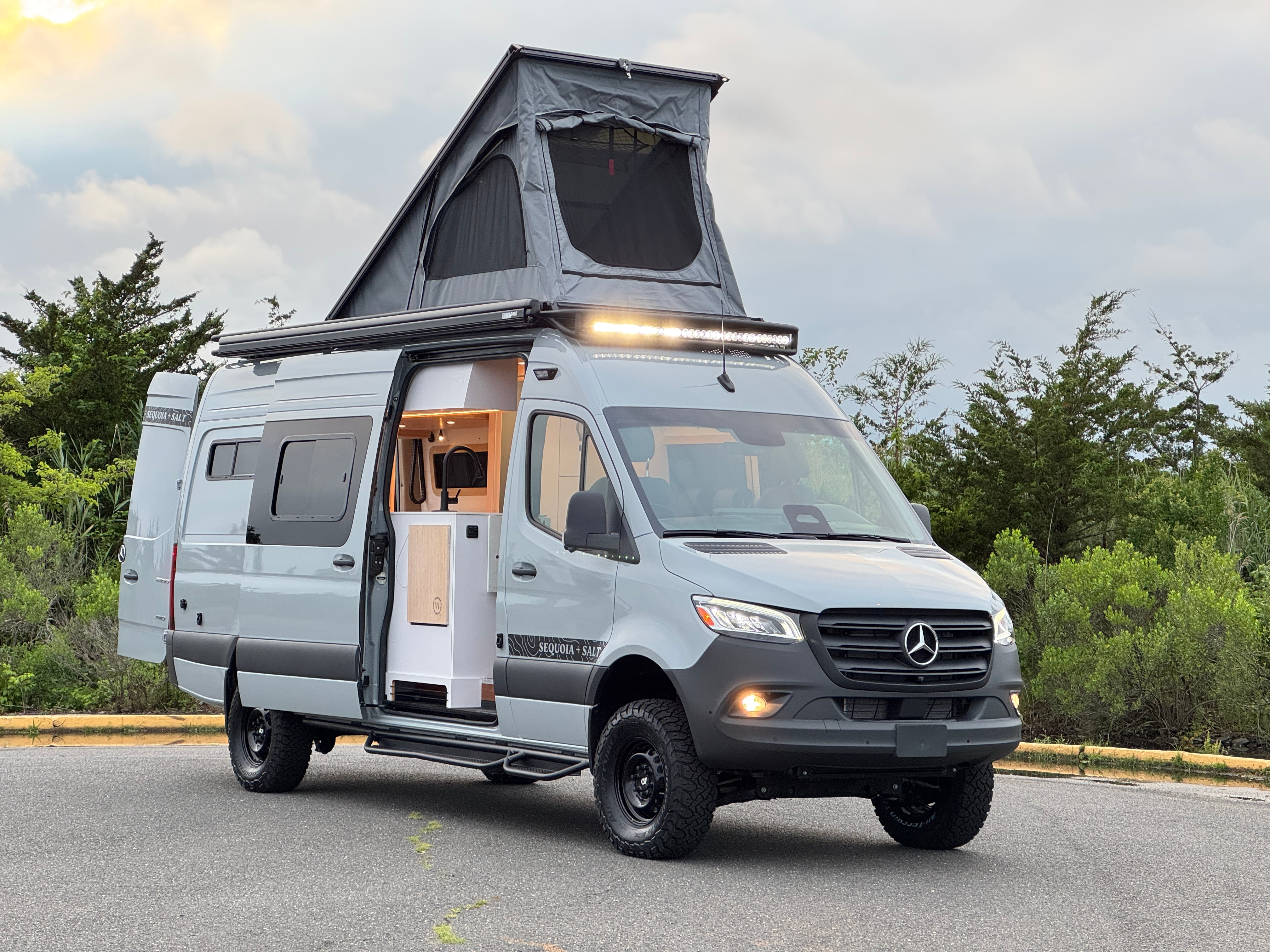 Skyrise Sprinter 170 campervan side profile with the pop-top penthouse roof raised