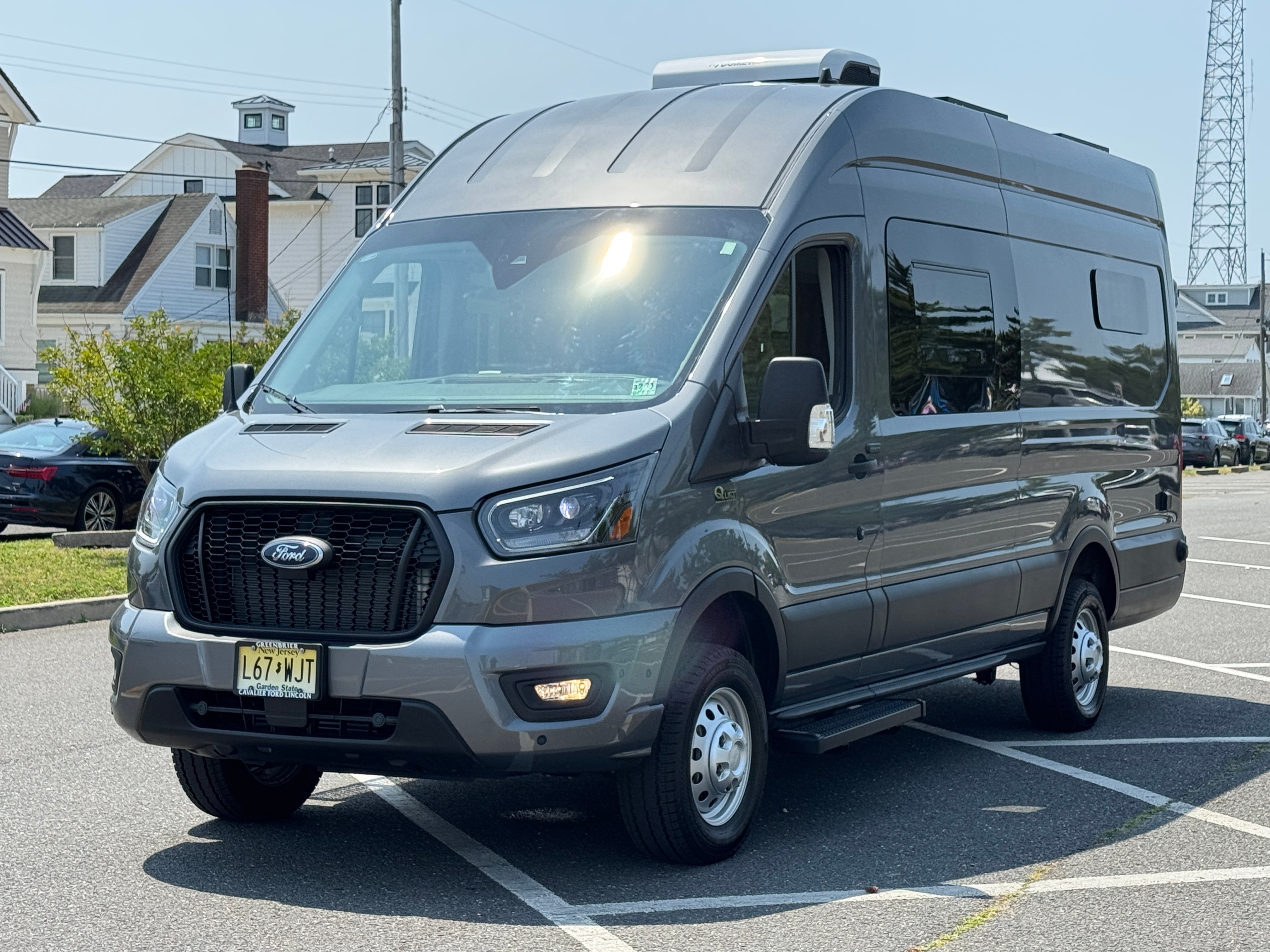 Super Lounger Ford Transit 148 extended campervan front three-quarter exterior in gray