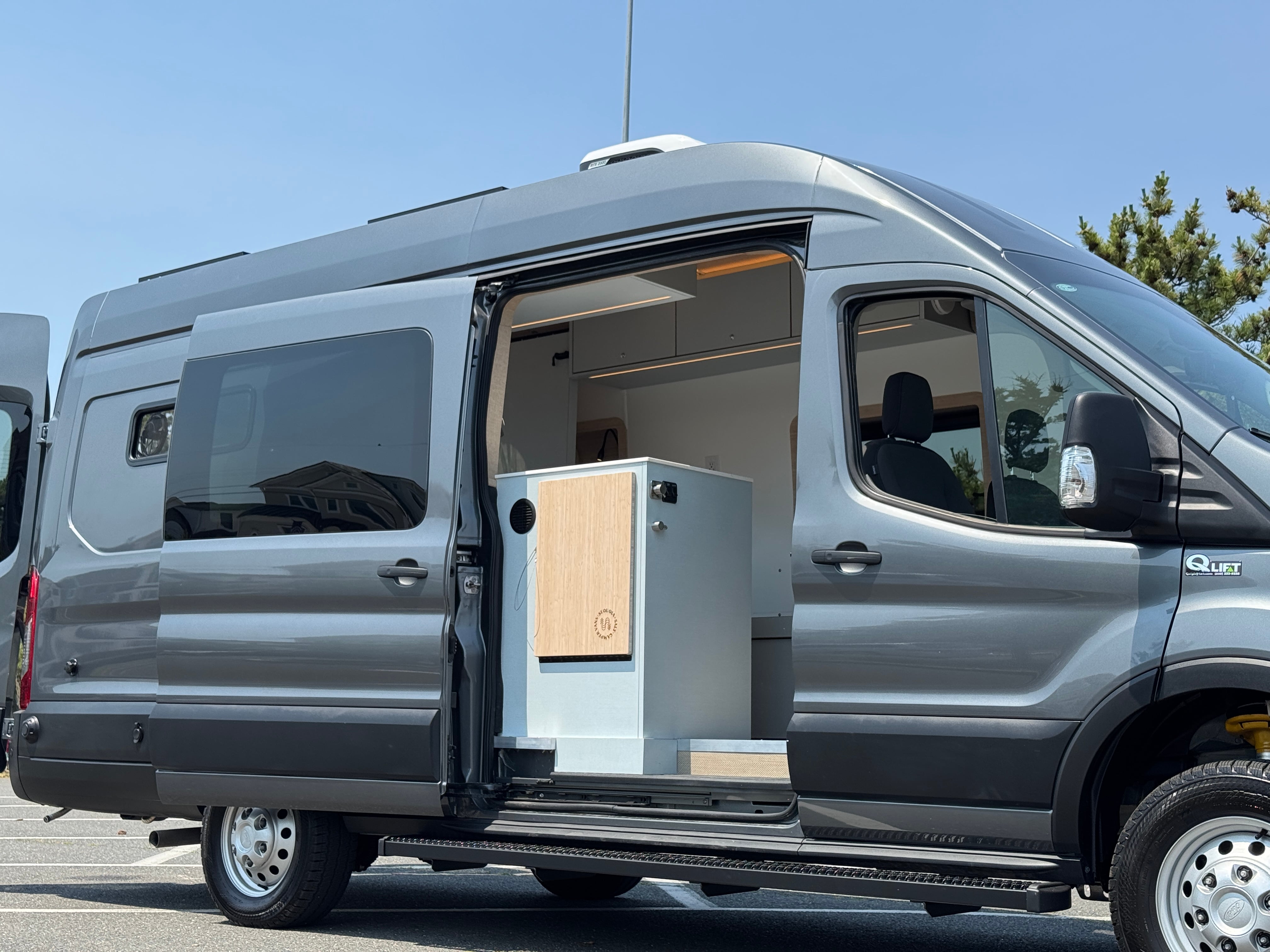 Super Lounger Ford Transit campervan with the sliding door open, side exterior