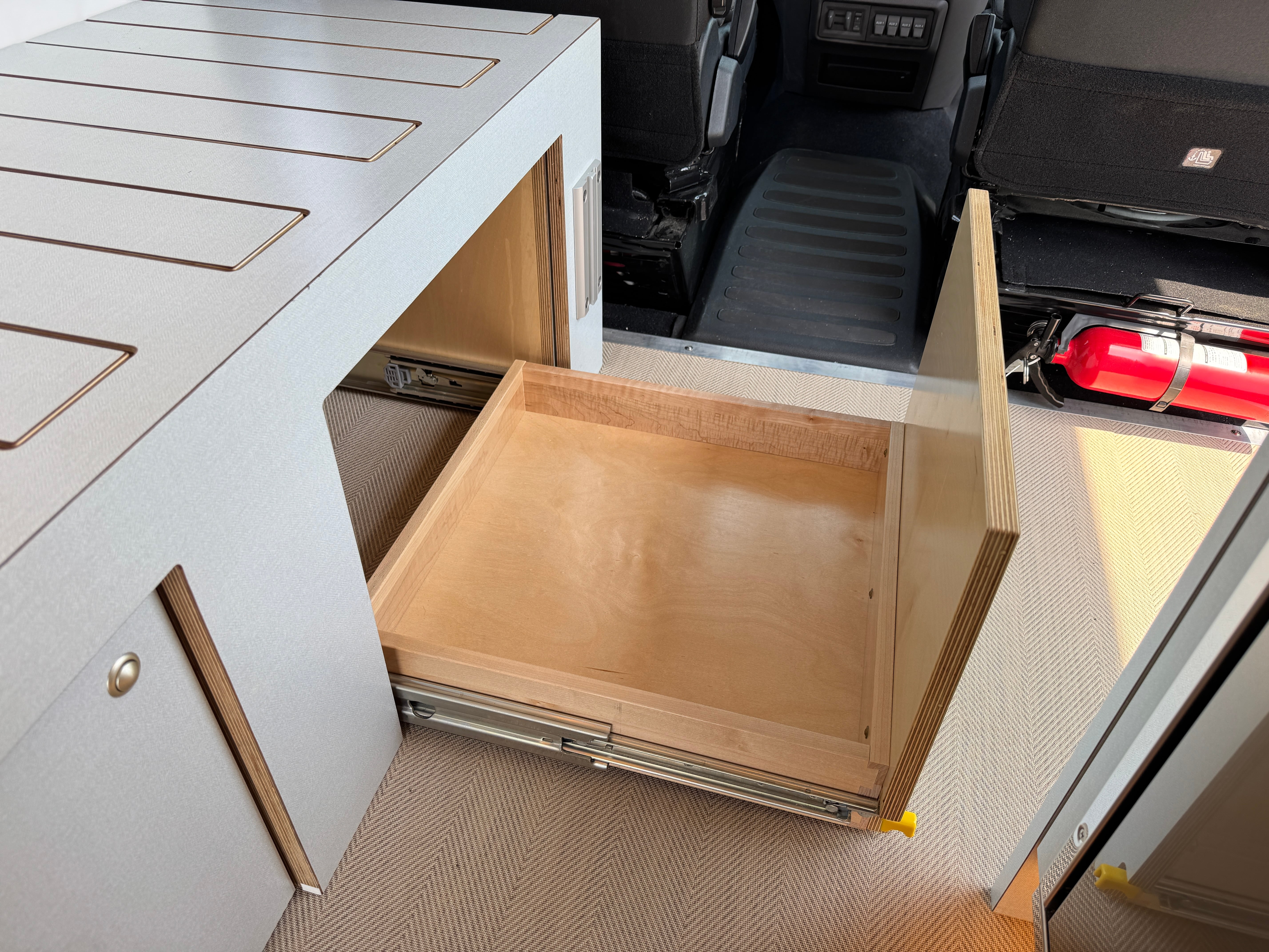 Super Lounger Ford Transit lower drawer pulled open beneath the galley