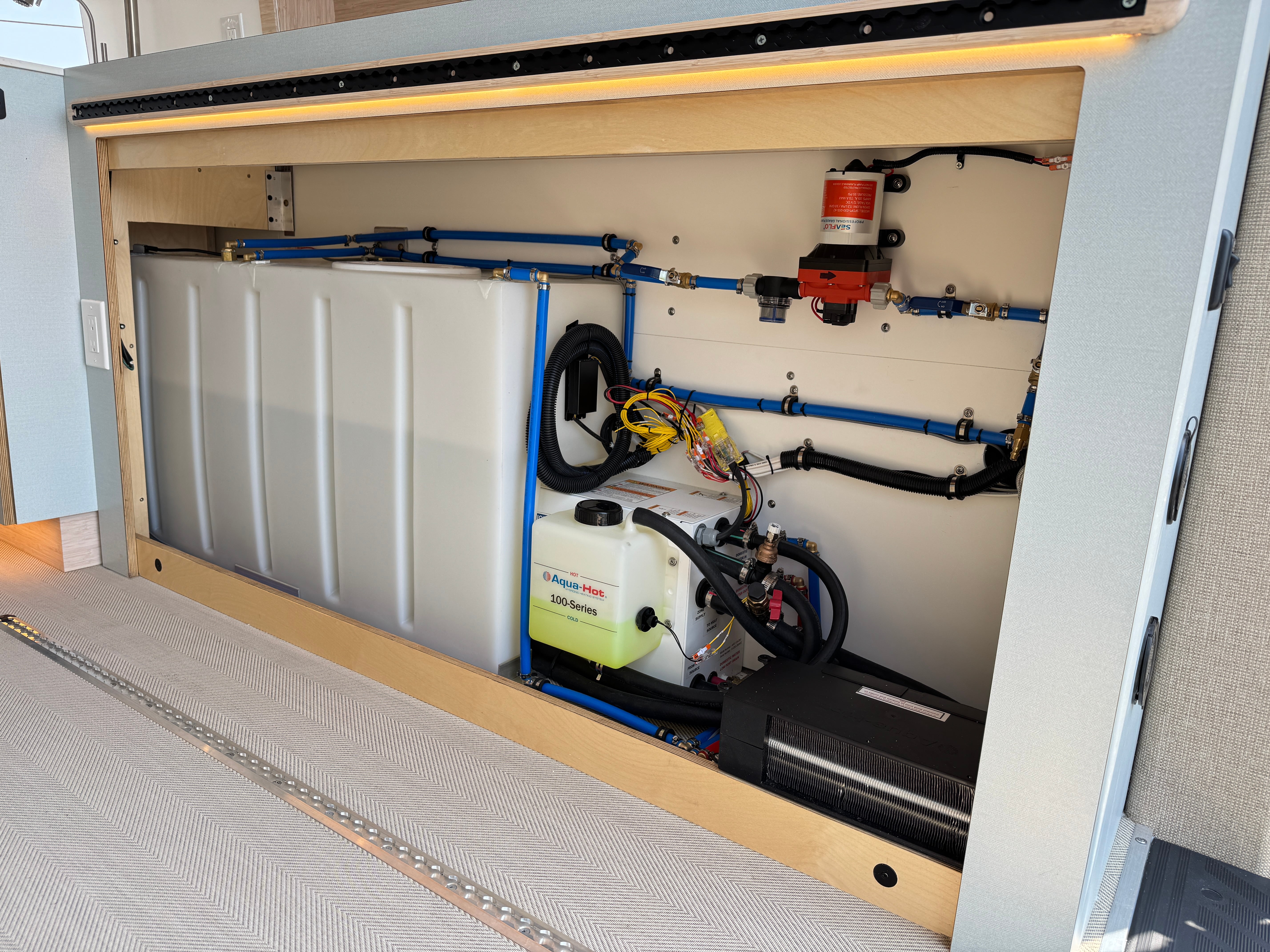 Super Lounger Ford Transit mechanical bay with plumbing and heating components