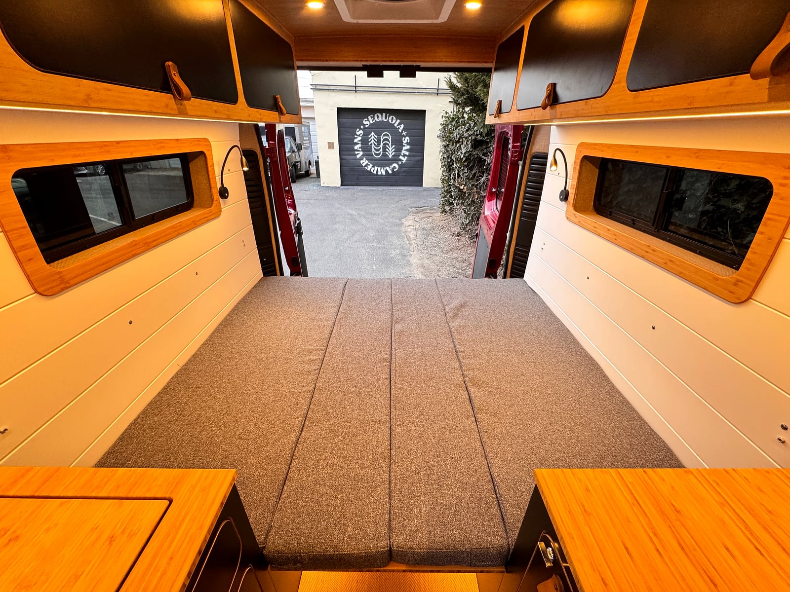 Bobal Mobile Salon — rear lounge converted to a sleeping platform for long-distance trips