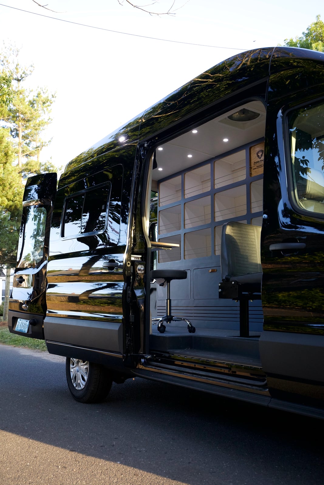 Northampton DCC electric Transit fleet — black Ford E-Transit 148 with sliding door open revealing the responder workspace