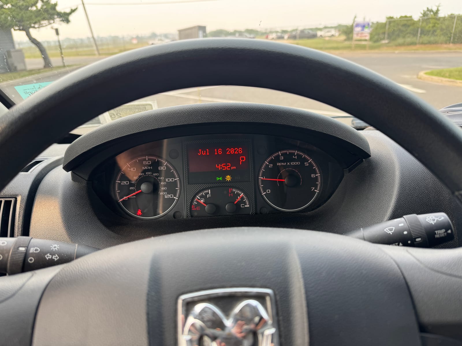 Instrument cluster behind the steering wheel