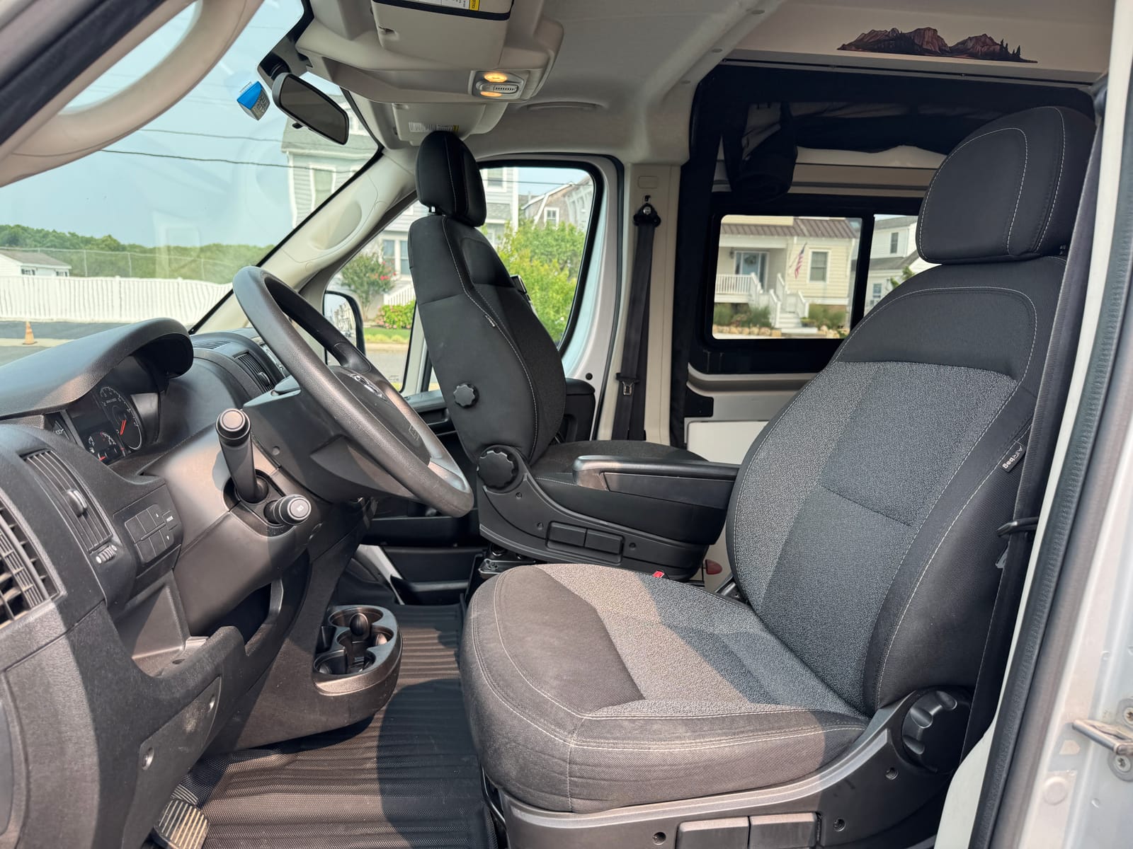 ProMaster cab with cloth seats, steering wheel and dashboard