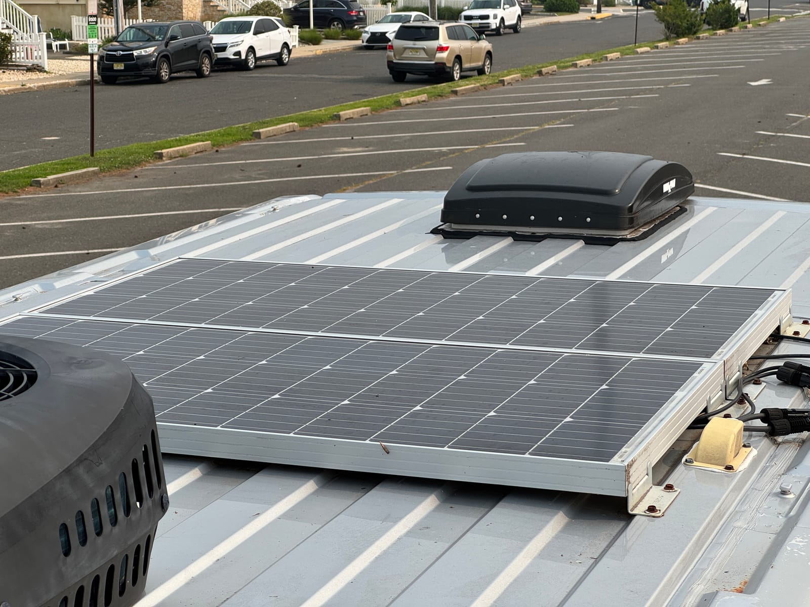 Rooftop solar panel mounted alongside the roof vent