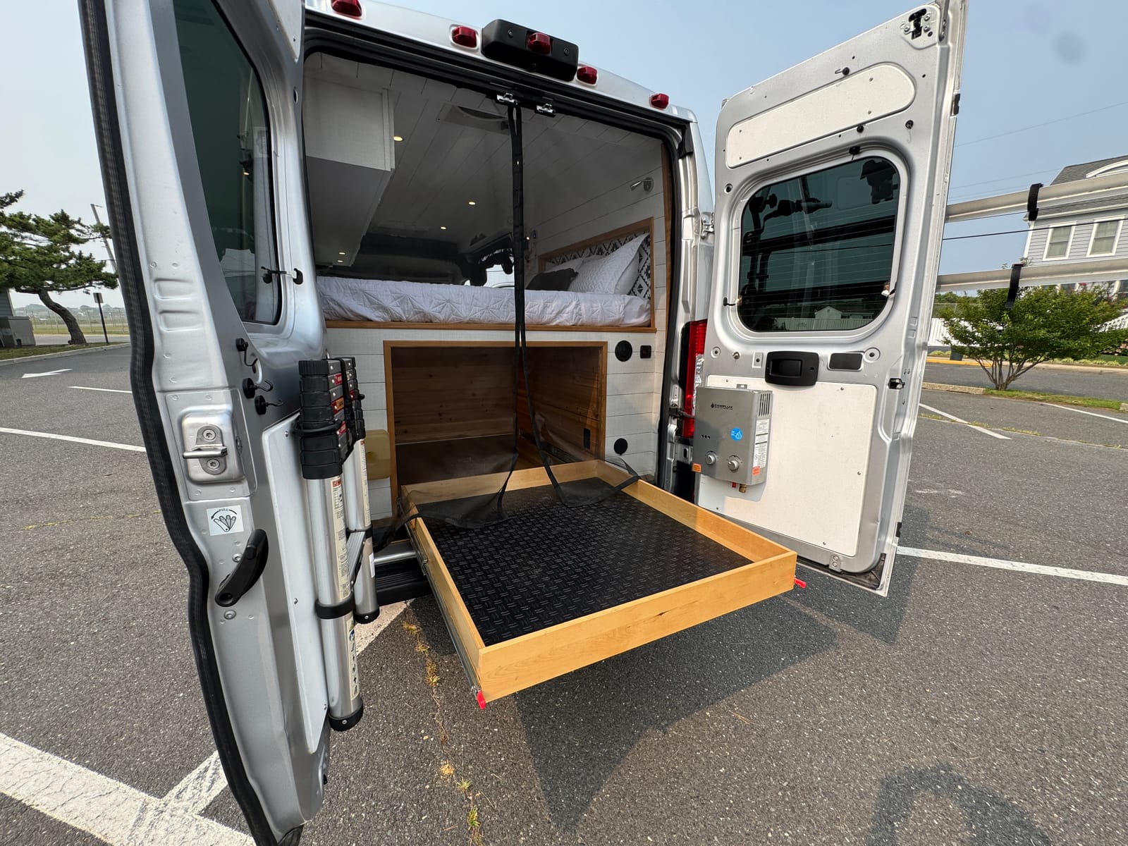 Large slide-out gear tray extended from the rear of the gear garage