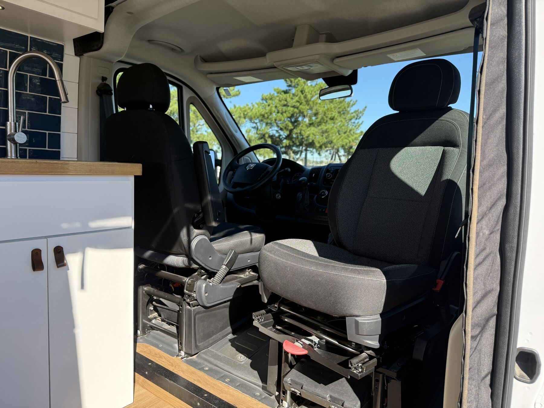 Cab with the passenger seat swiveled toward the living space