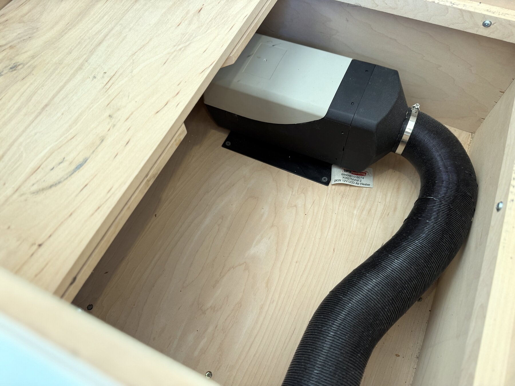 Heater unit and its ducting mounted under a bench seat