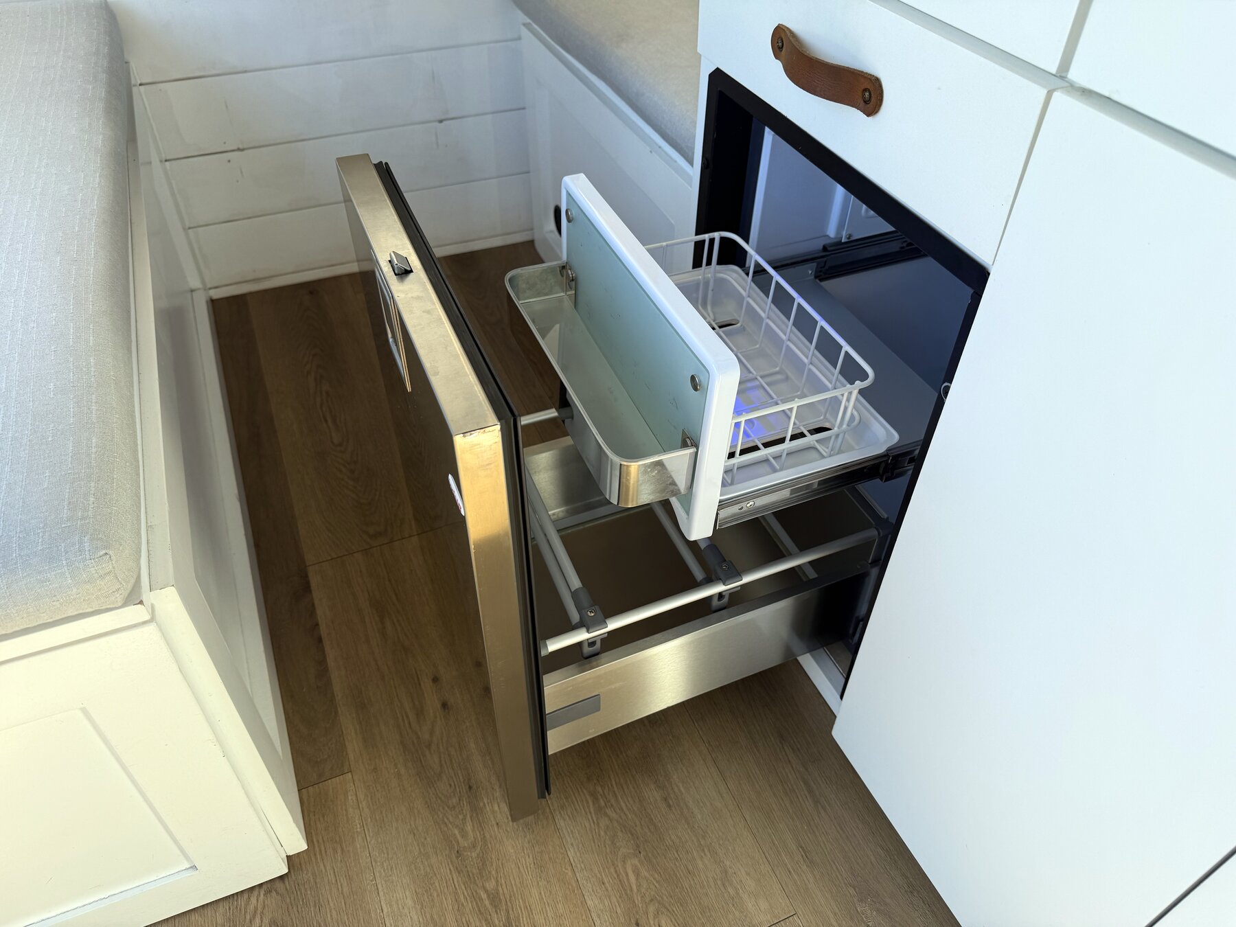Fridge door open, with a wire rack inside