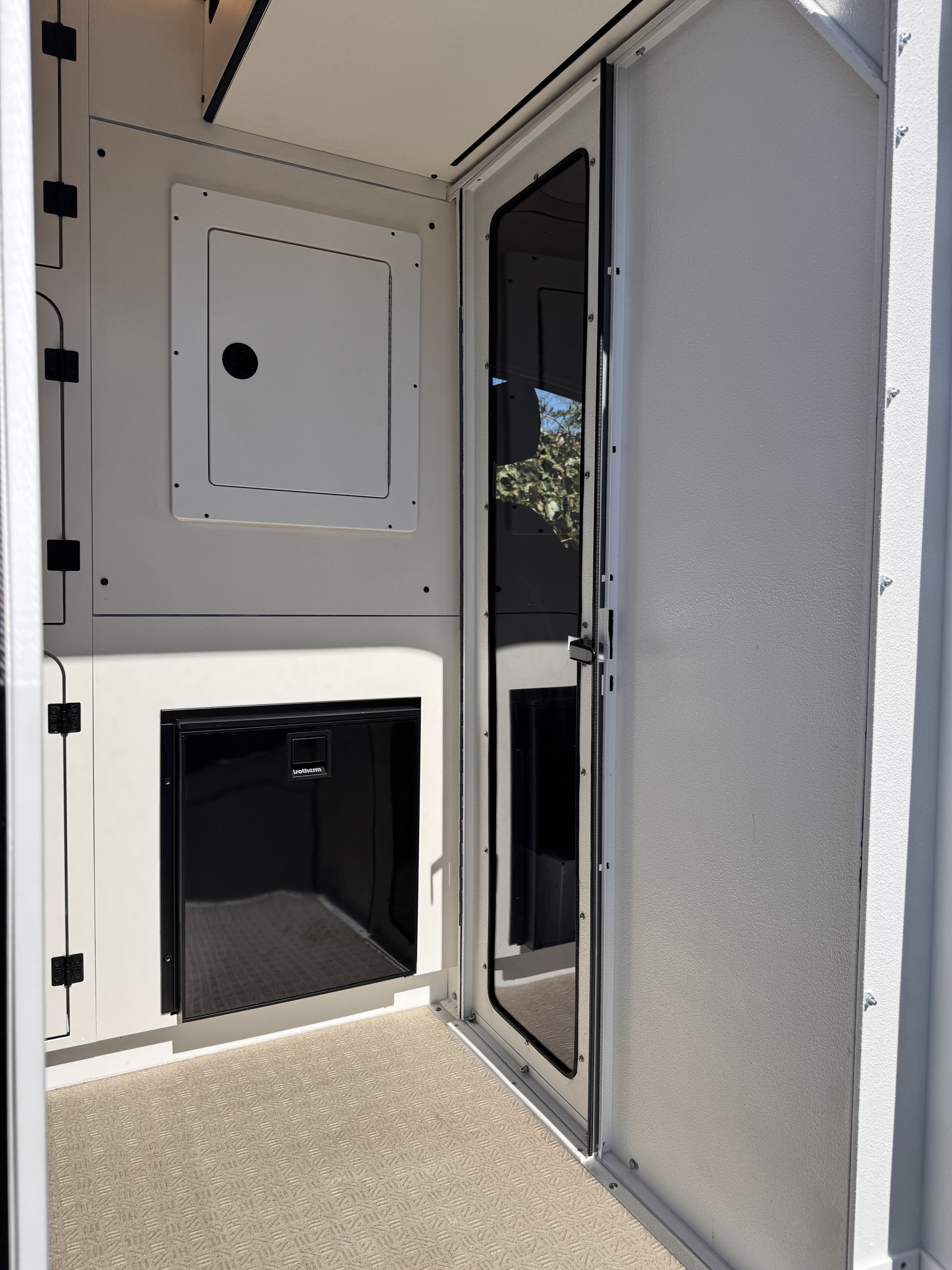K9 transport Sprinter — handler area with marine-grade Isotherm refrigerator and secure storage