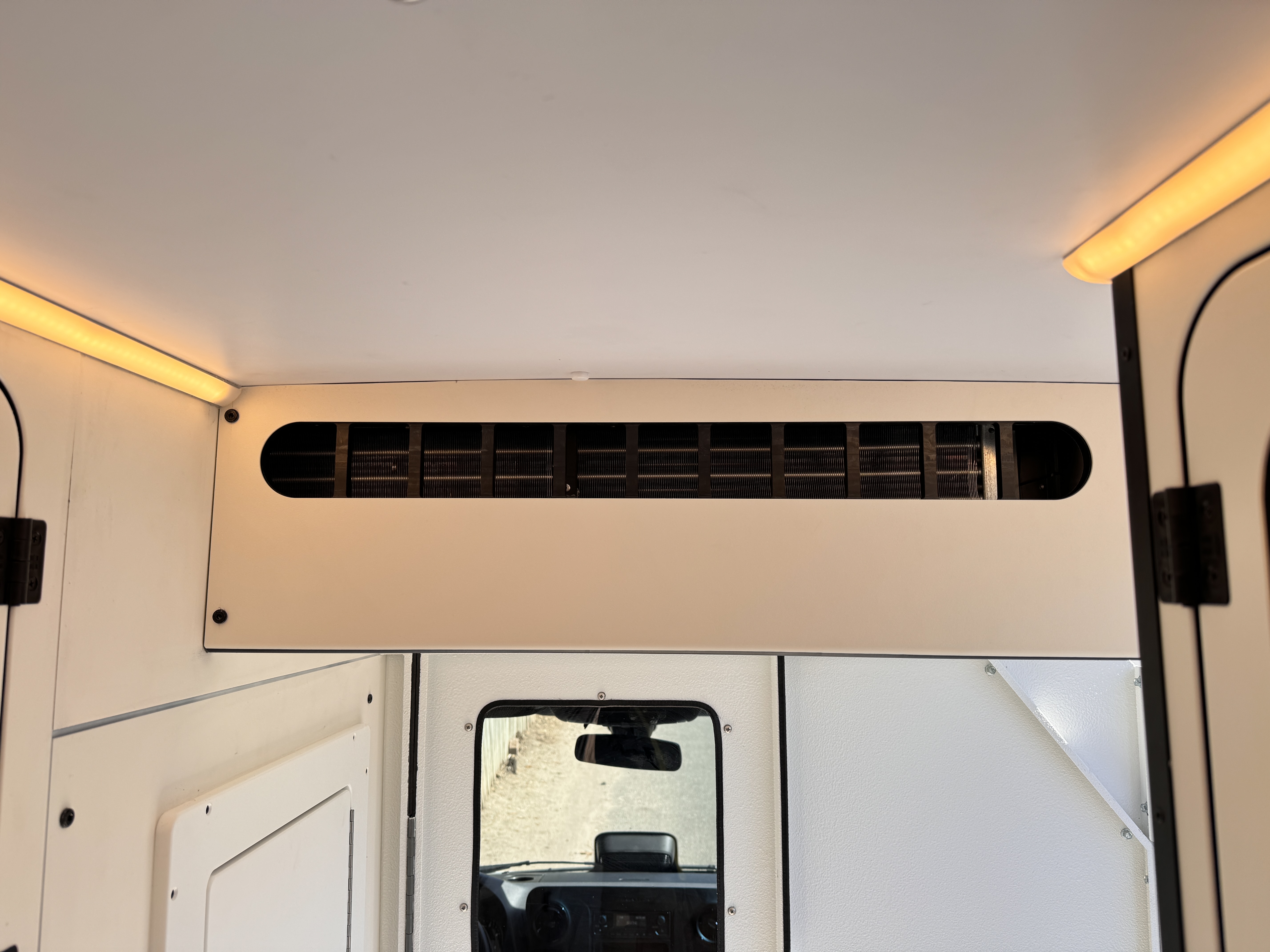 K9 transport Sprinter — HVAC vent and warm LED ceiling perimeter lighting