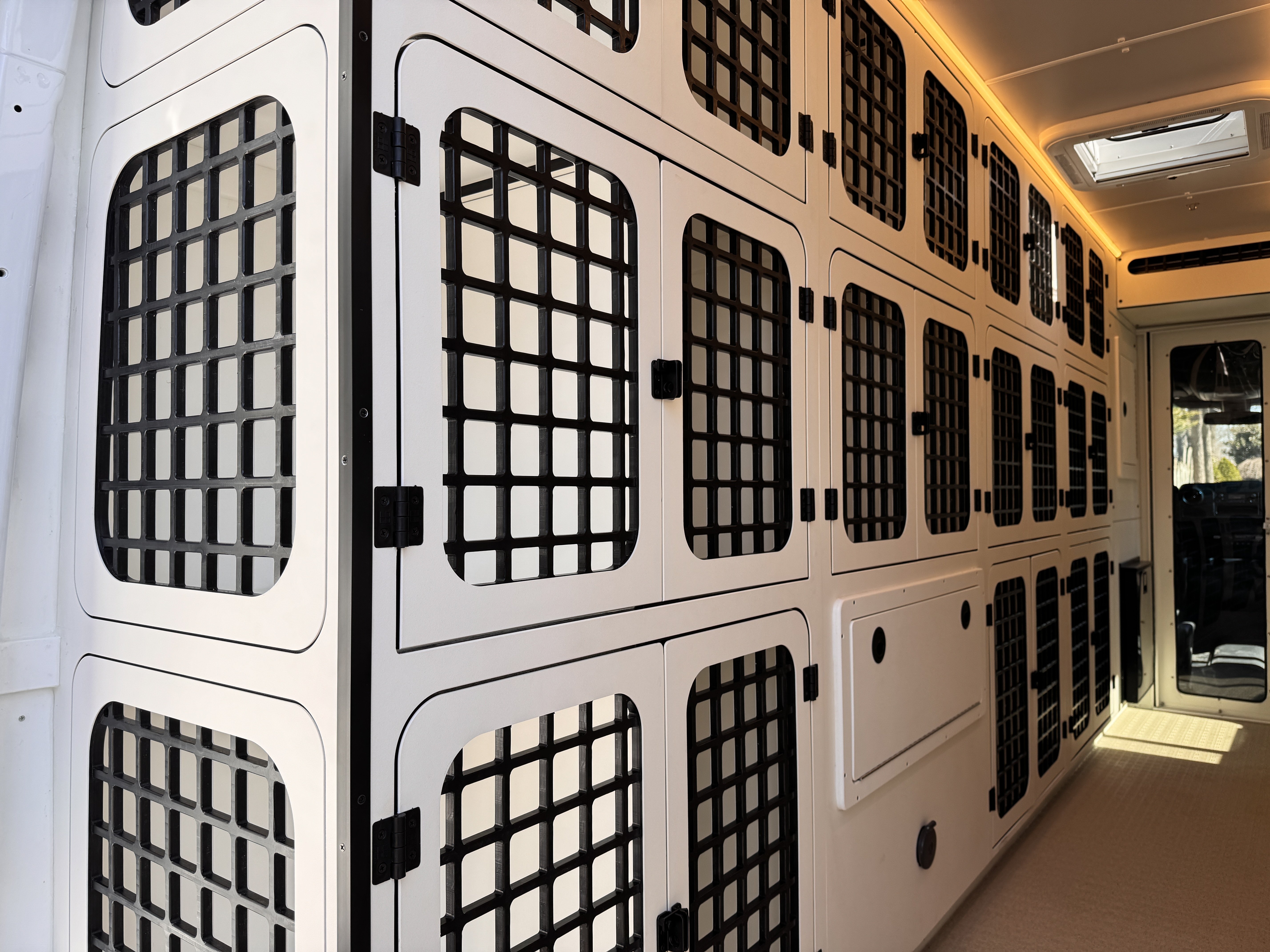 K9 transport Sprinter — kennel wall detail showing ventilated door grilles