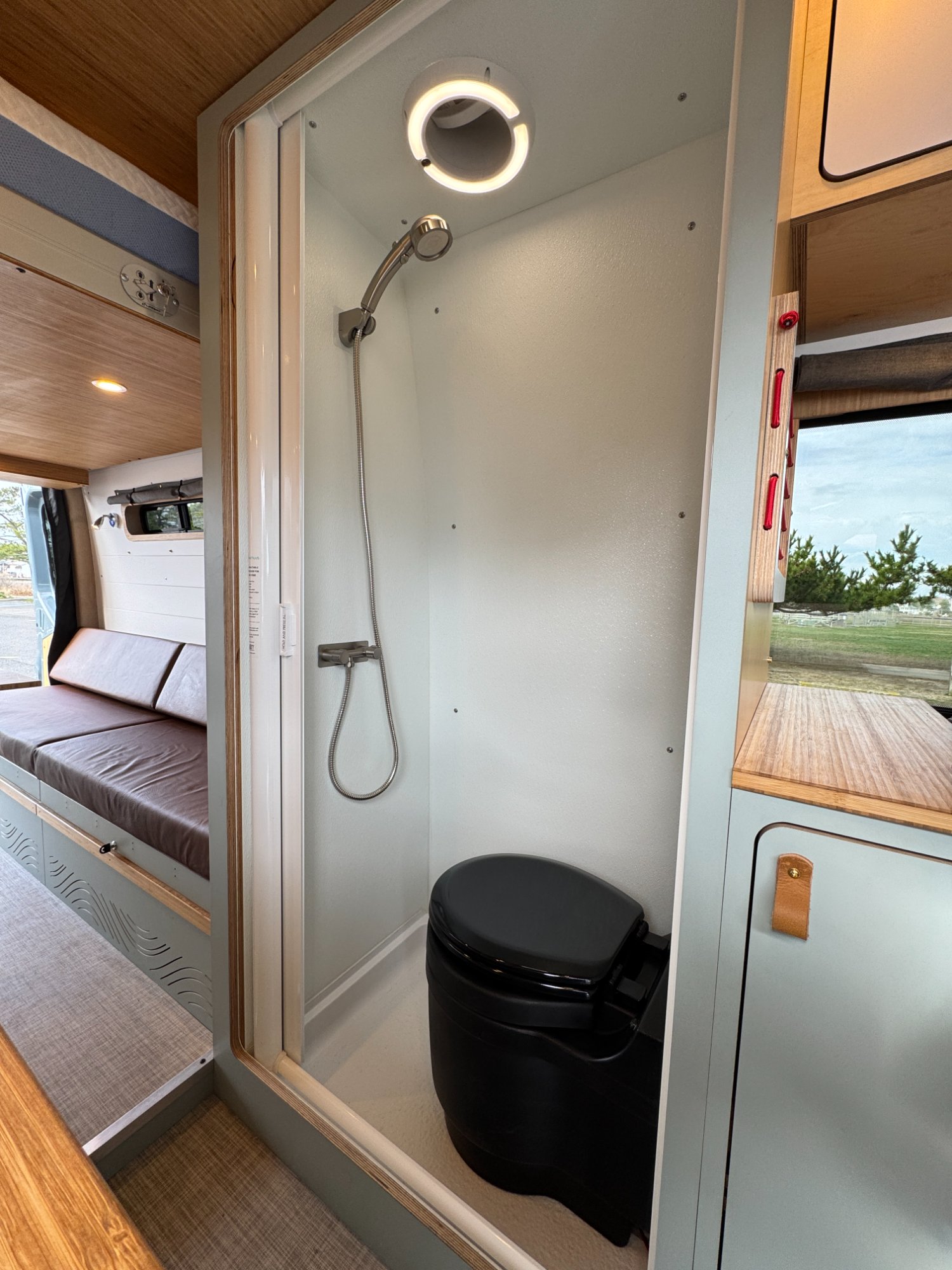Sprinter enclosed shower-toilet — placeholder for Drift Wood mid bath