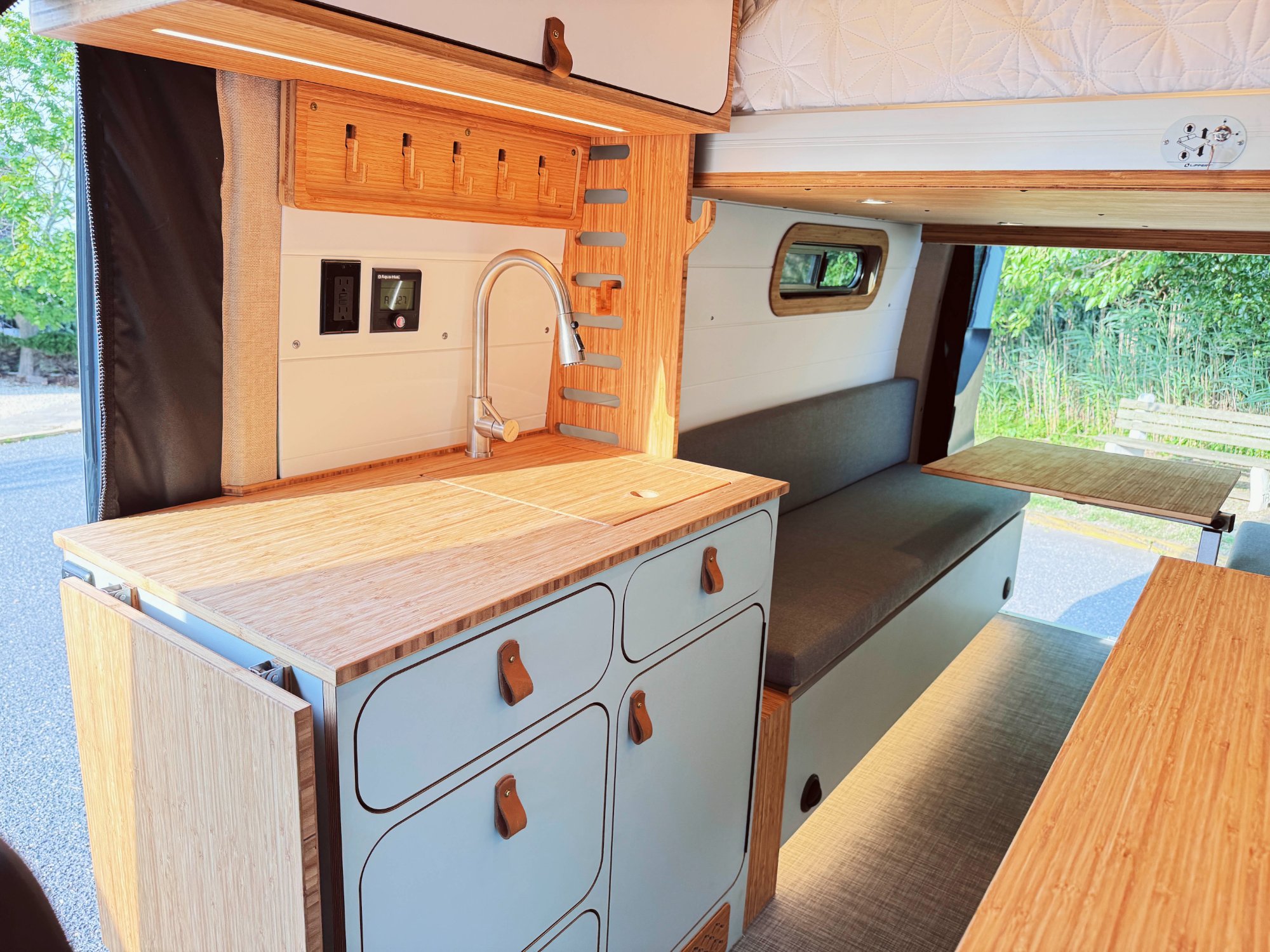 Loft lift-bed campervan with kitchen island