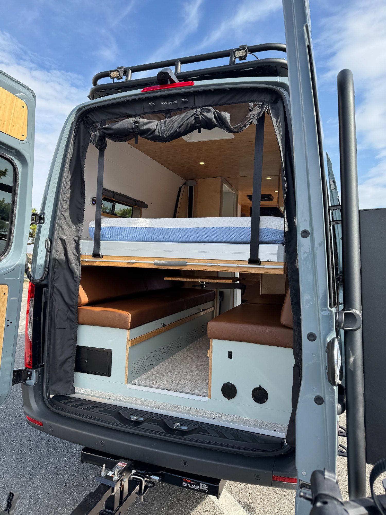 Sprinter rear view with bed deployed — placeholder for Linda Lou rear cabin