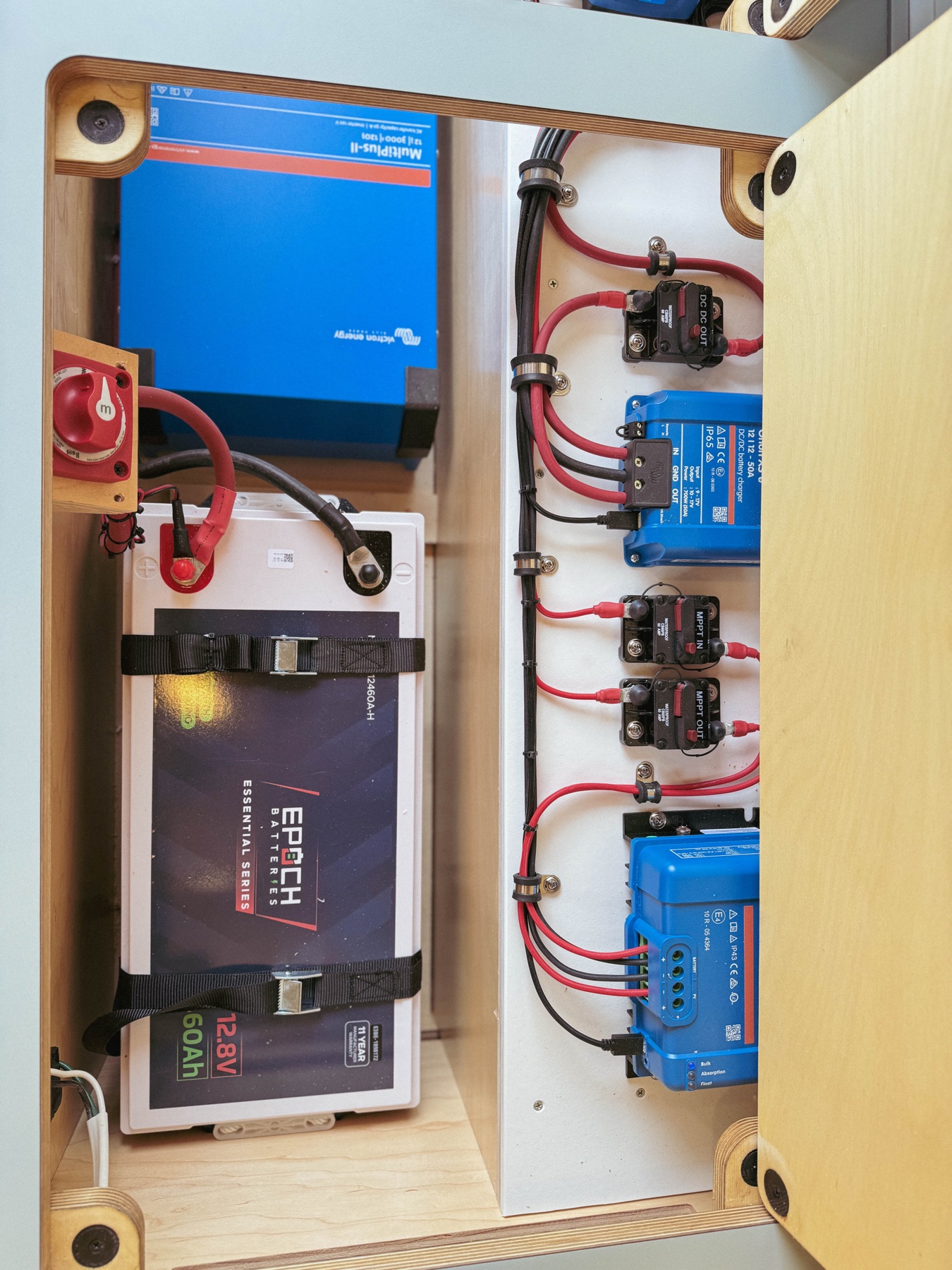Loft electrical bay — Victron MultiPlus inverter-charger with Epoch lithium battery, cleanly installed
