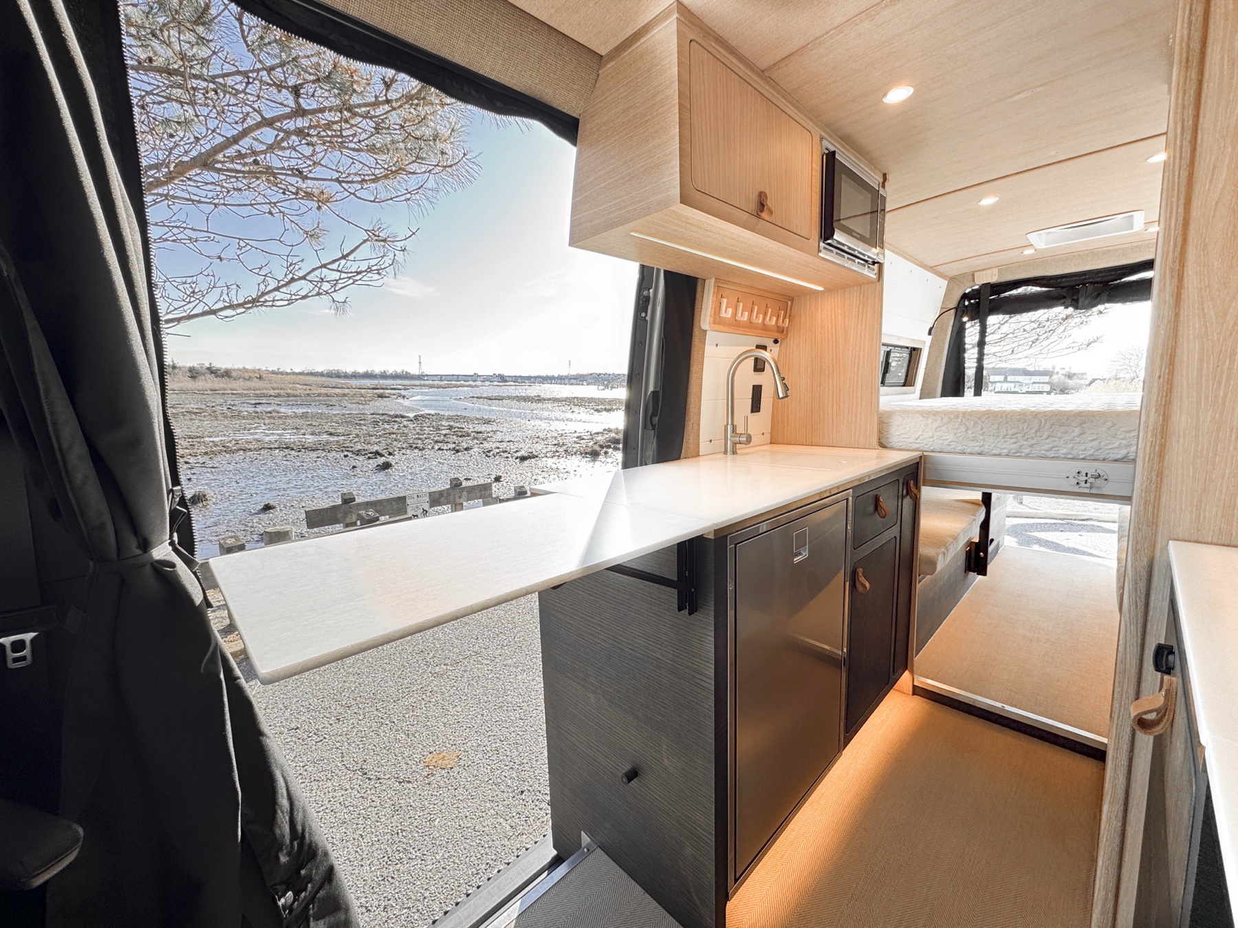 Pristine Sequoia + Salt galley with slider open to the marina — built to look this way at year 15
