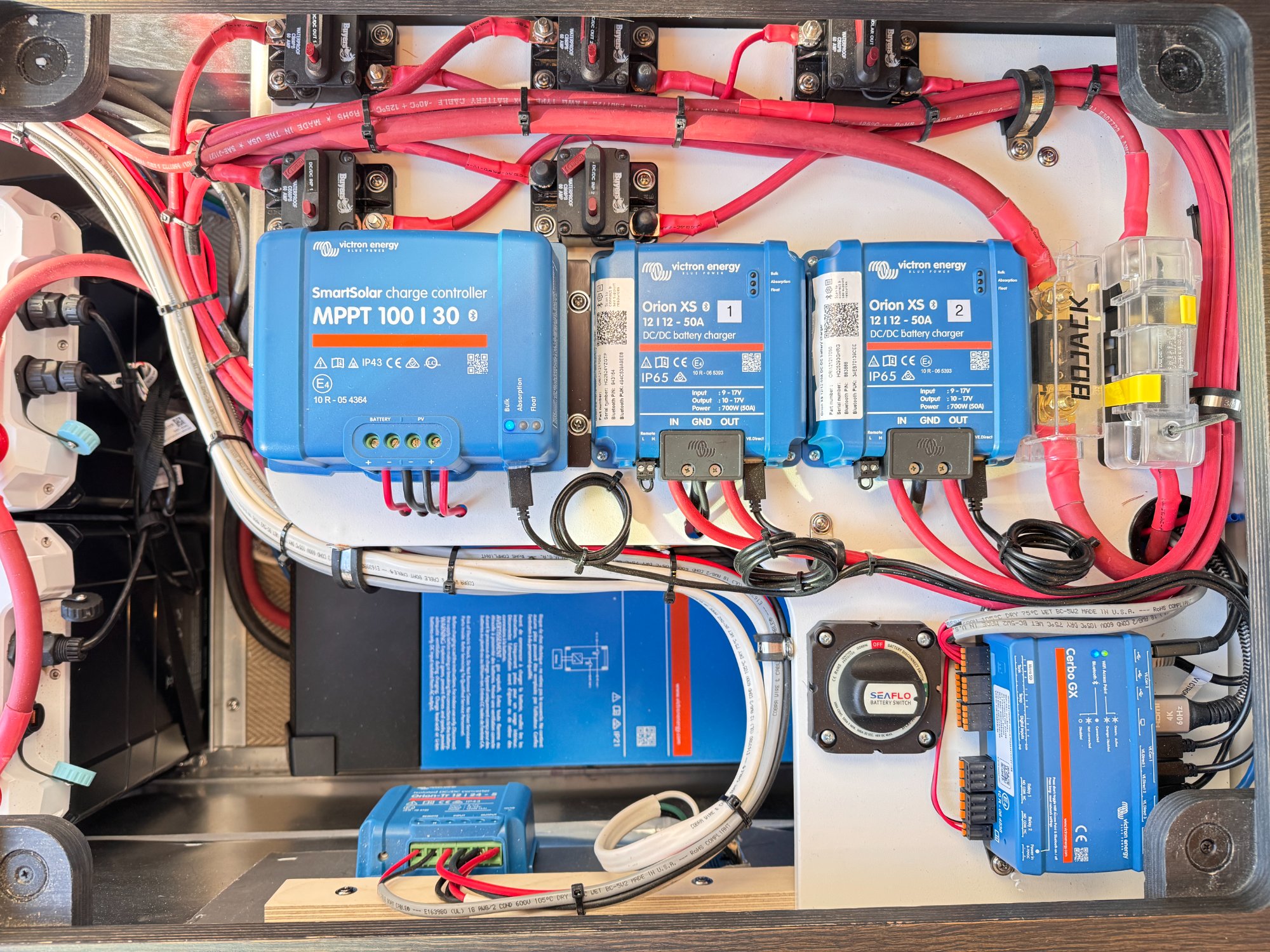 Victron-architected power system — same hardware family used in the K9 build: SmartSolar MPPT, dual Orion XS DC-DC chargers, Cerbo GX, battery disconnect.