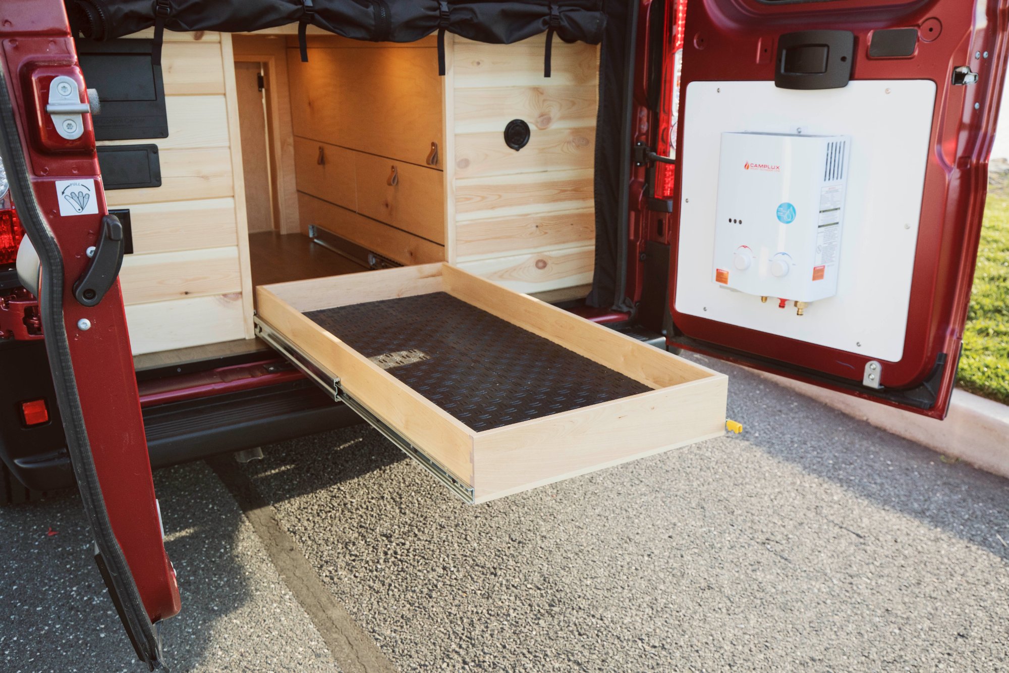 ProMaster pull-out gear drawer — placeholder for Wild Flower gear drawer with sleeping pads stored