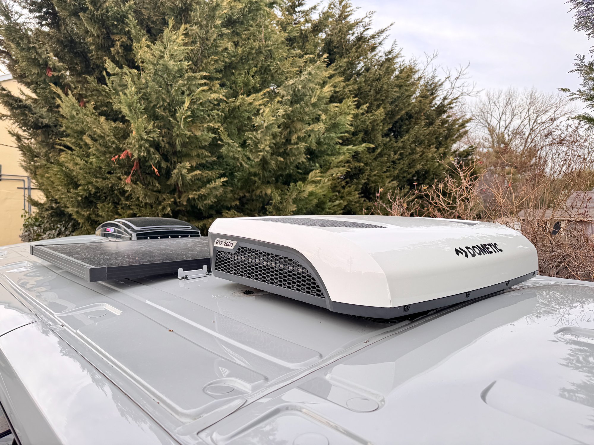 Rooftop AC and climate equipment install on a camper van