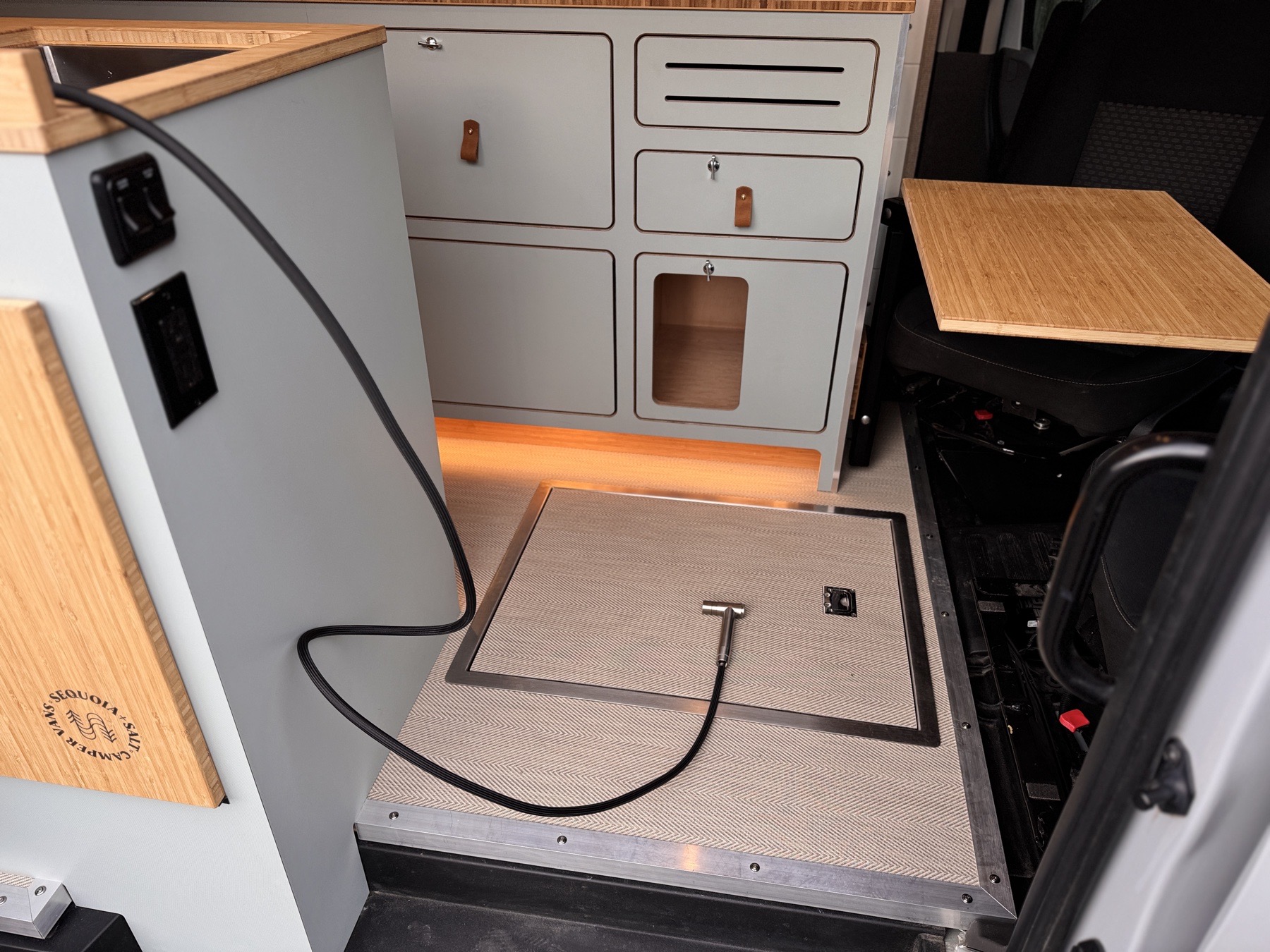 Scout — wet-bay floor drain with shower hose access