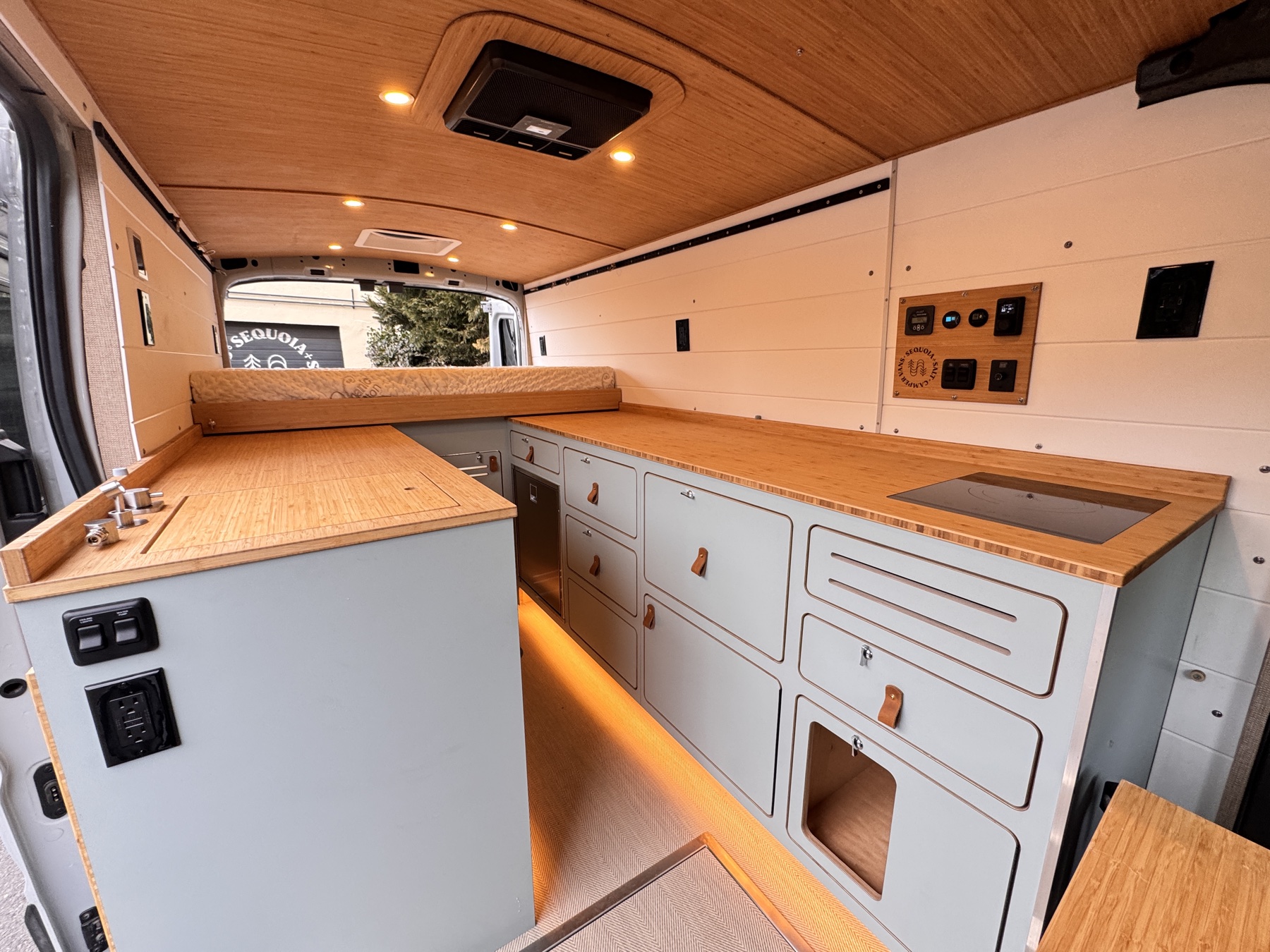 A semi-custom Sequoia + Salt campervan interior — proven layout configured with modern systems and personalized finishes