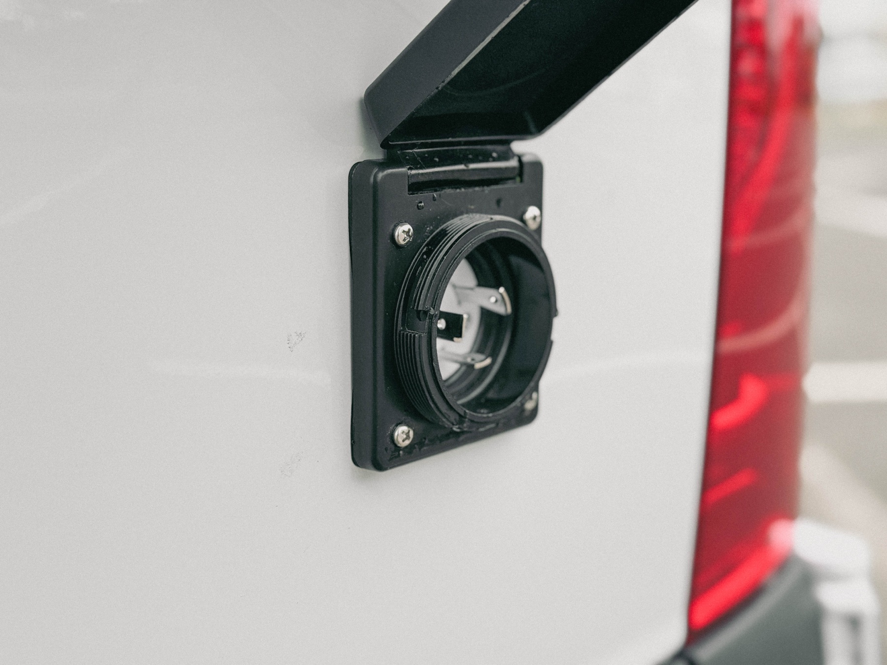Exterior shore power inlet on Loft van for plug-in hookups